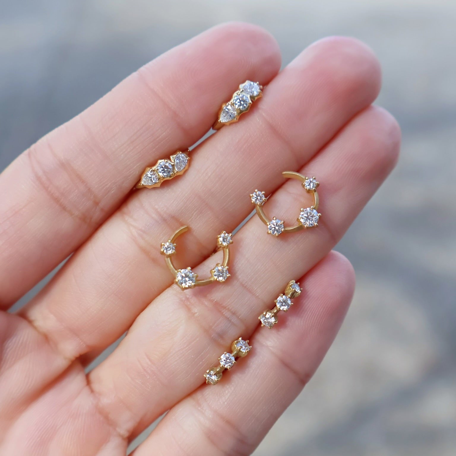 18k yellow gold diamond posey huggie earrings by Jade Trau Tiny Gods