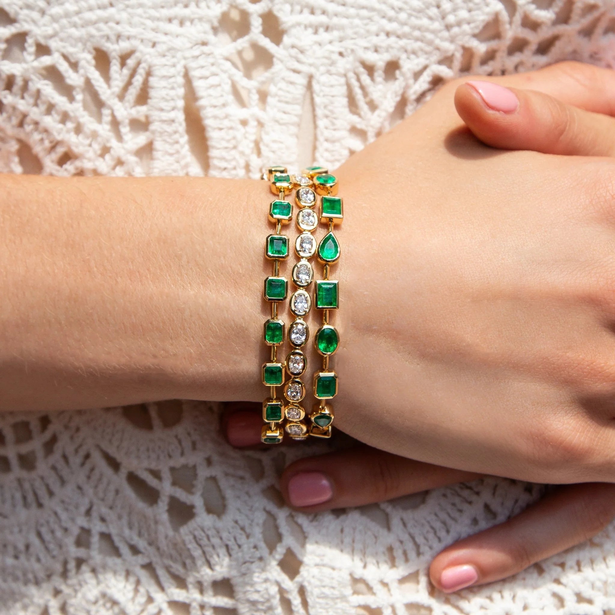 18k yellow gold mixed shape pear, emerald cut, pear, oval Colombian emeralds bezel set tennis sonnet bracelet Ruchi Tiny Gods