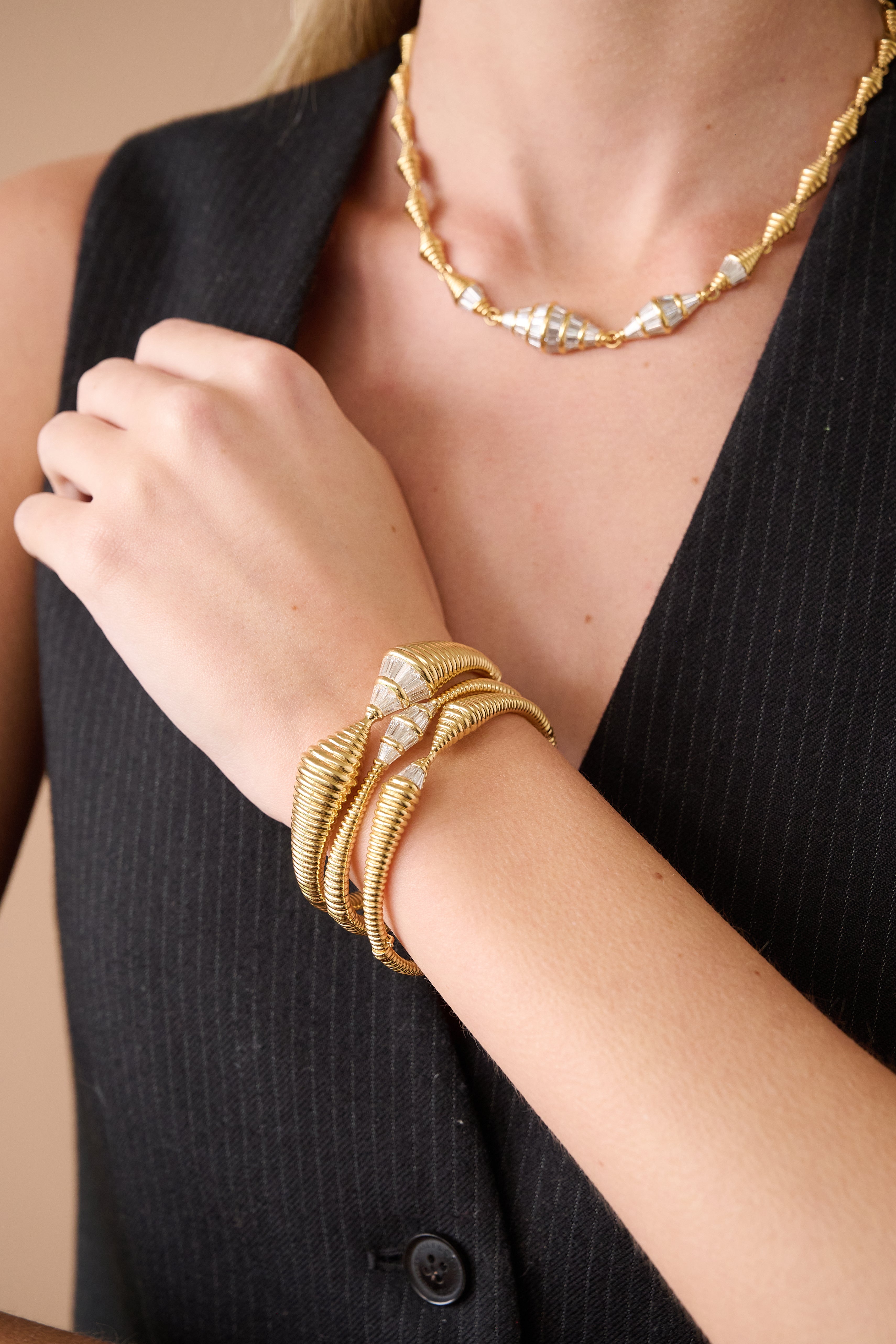 18k yellow gold tapered baguette diamond medium spectrum bracelet by Nikos Koulis Tiny Gods on model