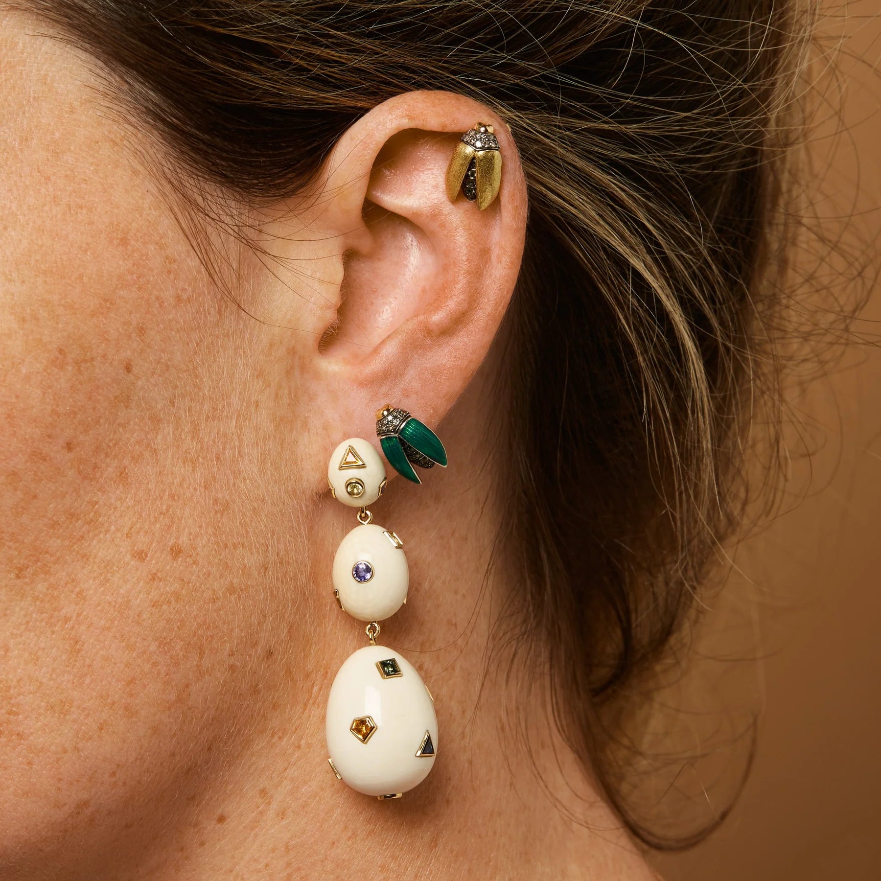 18k yellow gold tsavorite open wing scarab earring stud by Bibi van der Velden Tiny Gods on model shown on ear