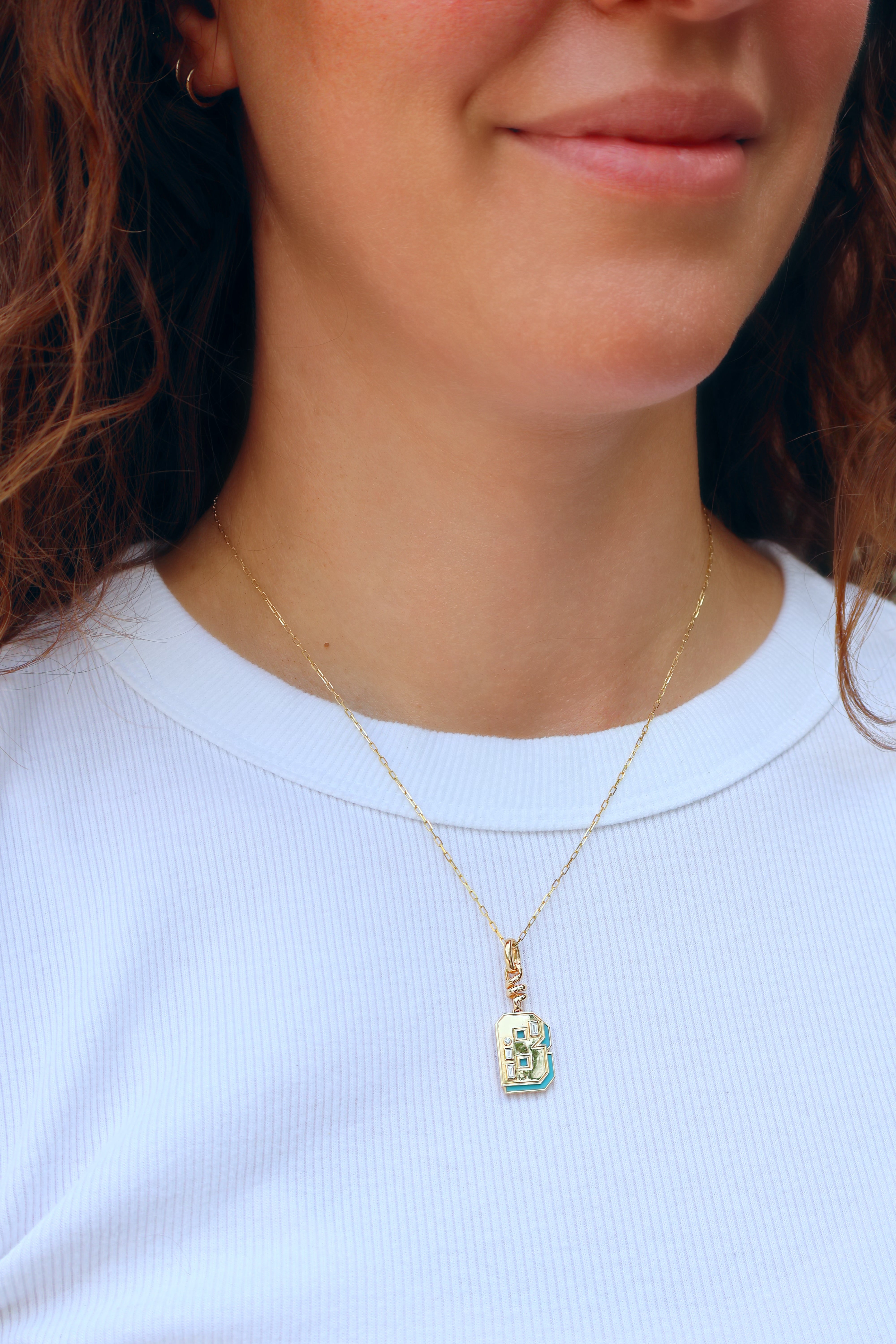 18k yellow gold and turquoise inlay b charm slinky by Boochier Tiny Gods