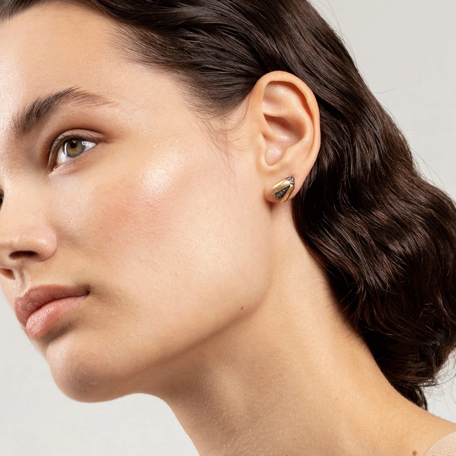 18k yellow gold tsavorite open wing scarab earring stud by Bibi van der Velden Tiny Gods on model shown on ear