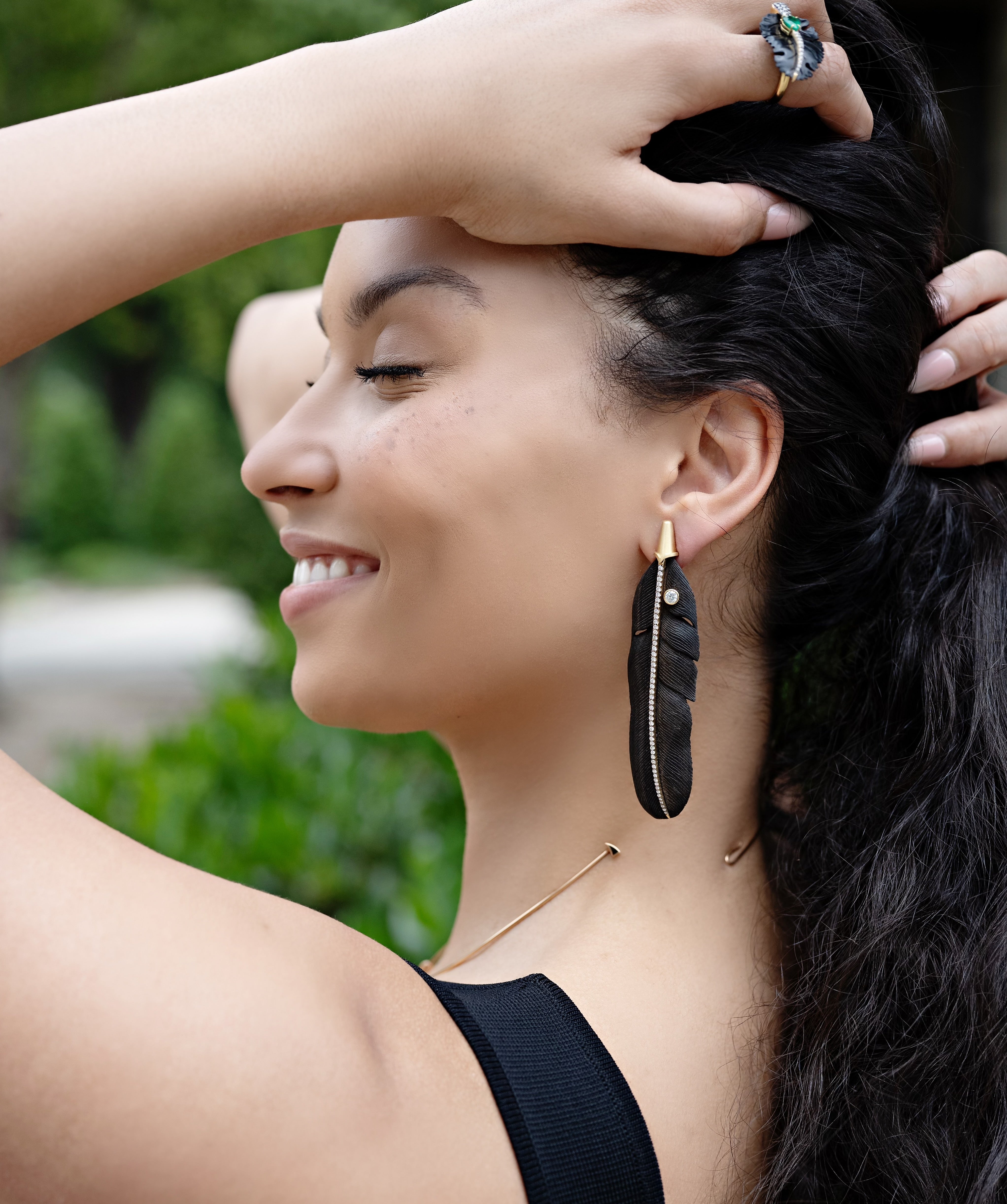 18k yellow gold and diamond black carved feather long earrings by Silvia Furmanovich Tiny Gods on model