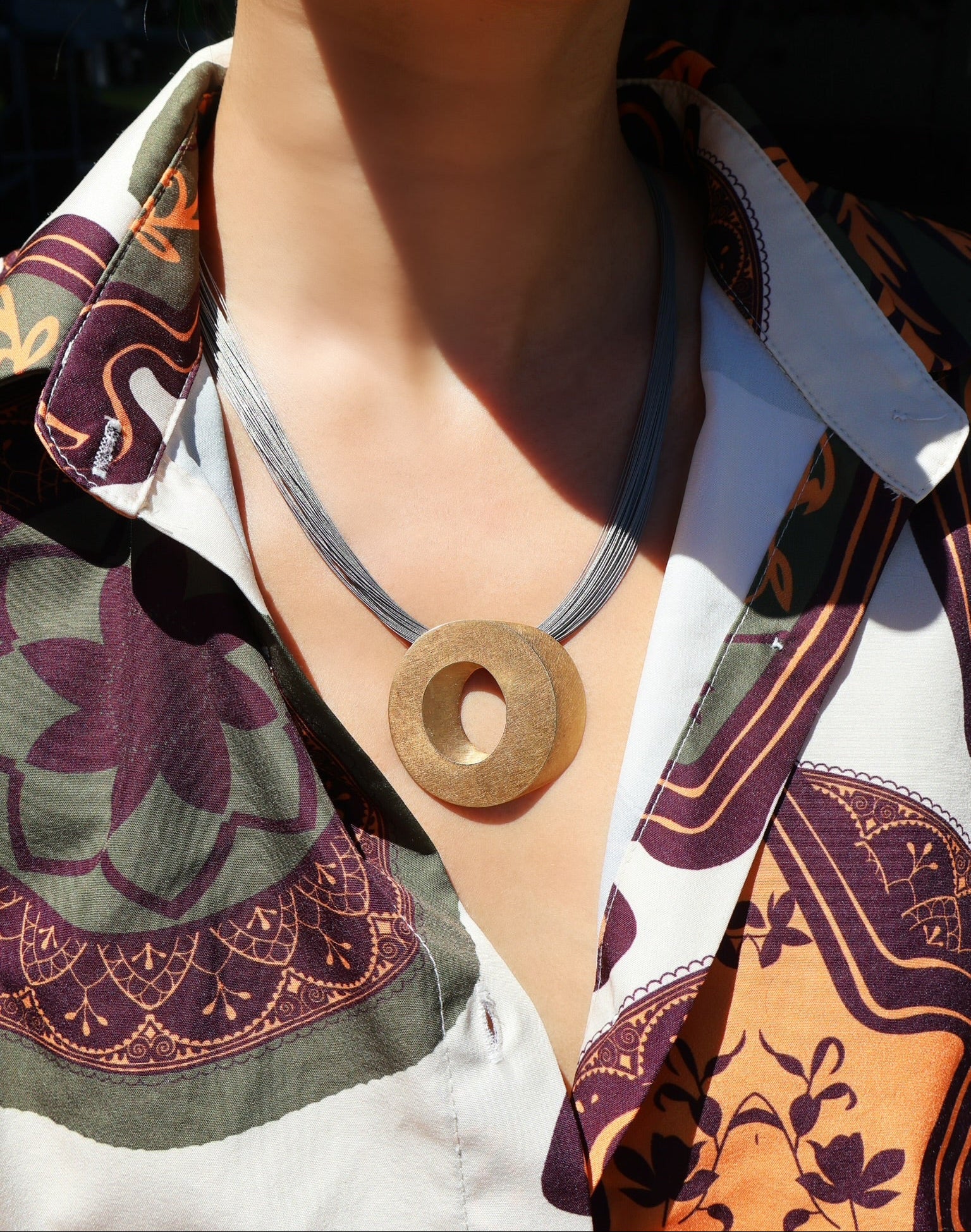 18k yellow gold and titanium trompe loeil Claude chavent Paris geometric o pendant necklace disk charm