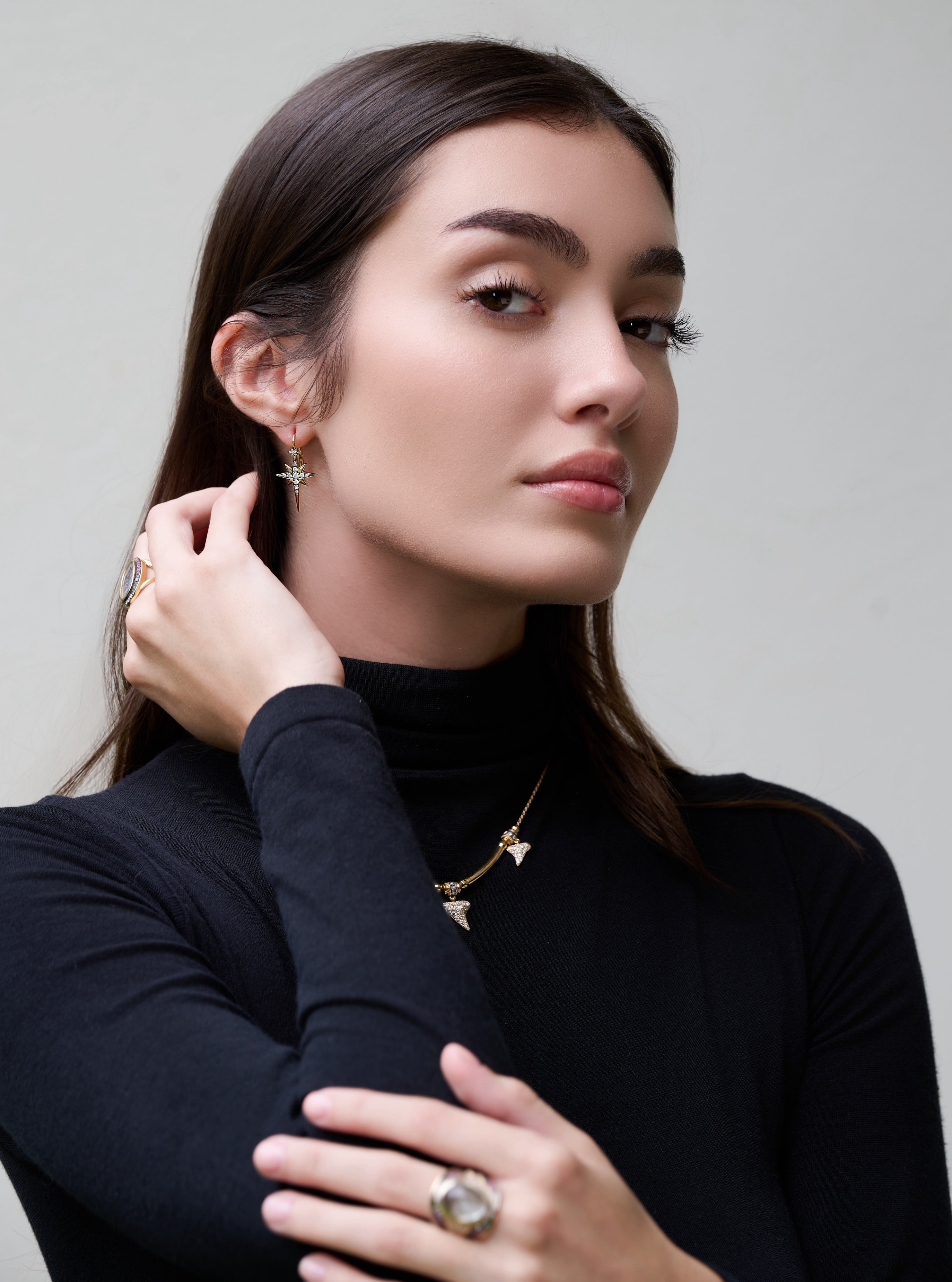 18k yellow gold diamond star Astraea North Star earrings by Venyx Tiny Gods on model