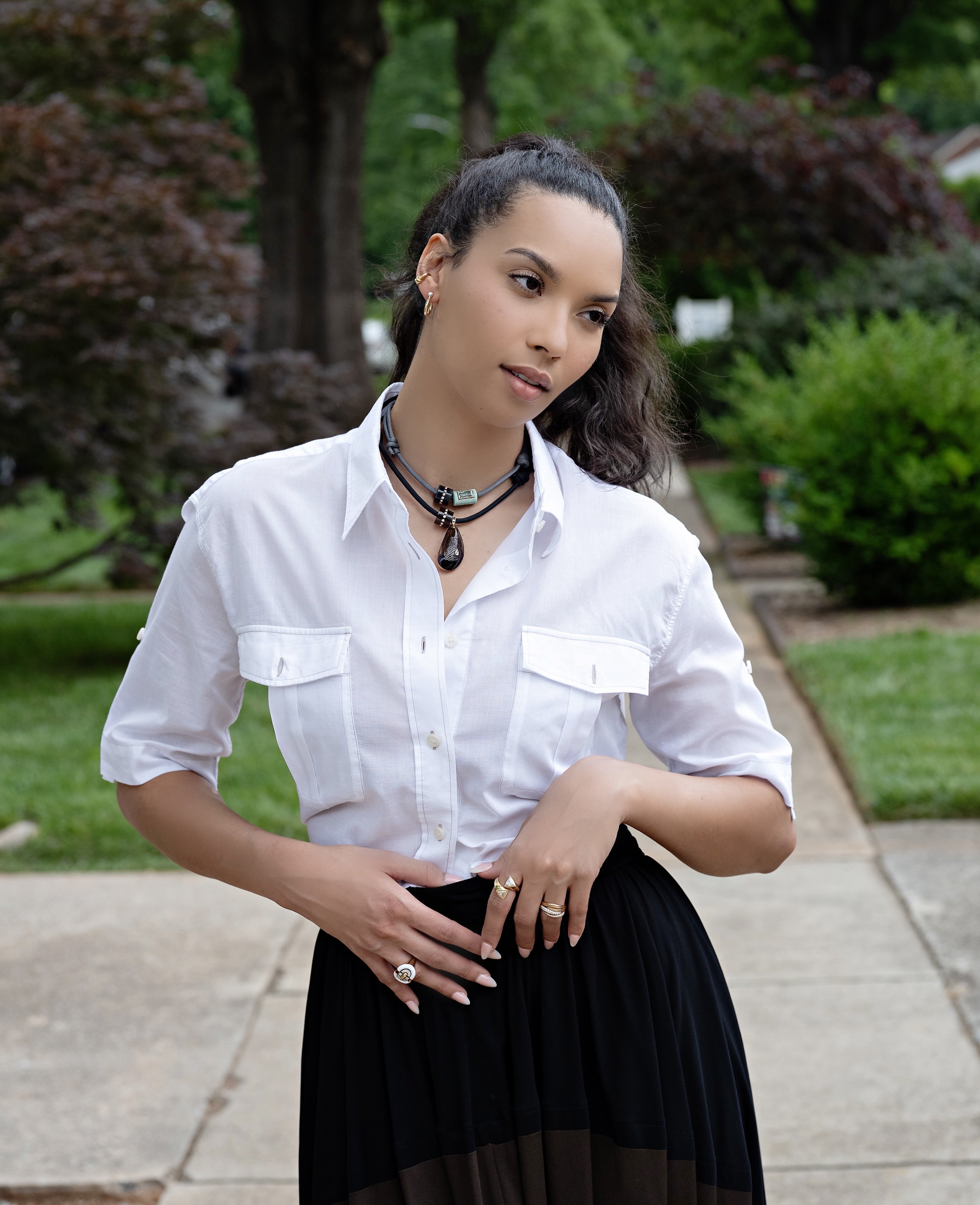 18k rose gold, shell and bumper bead with diamonds charm shell pendants on black paracord by Sara Beltran of Dezso at Tiny Gods on model