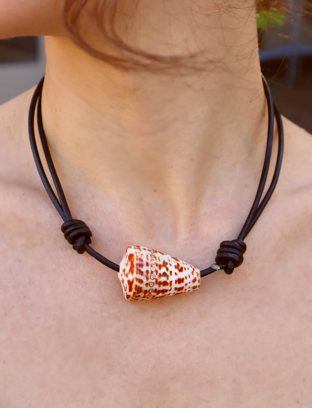 18k rose gold extra XL conus shell with diamonds strung on black leather cord by Dezso Tiny Gods