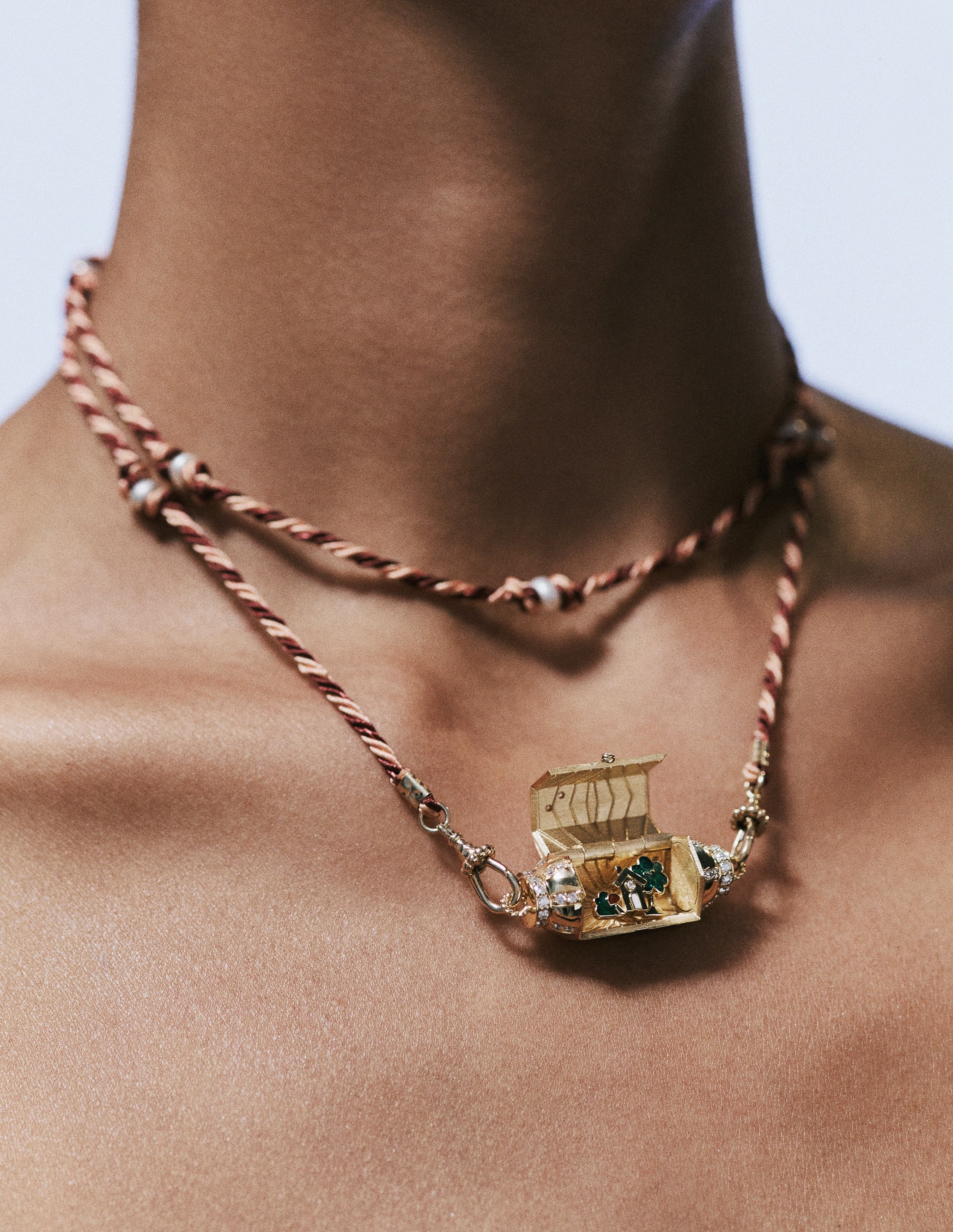 18k yellow gold home locket box "home is everywhere you are" with green enamel and diamonds with pink/red maul pearl cord pendant by Marie Lichtenberg Tiny Gods