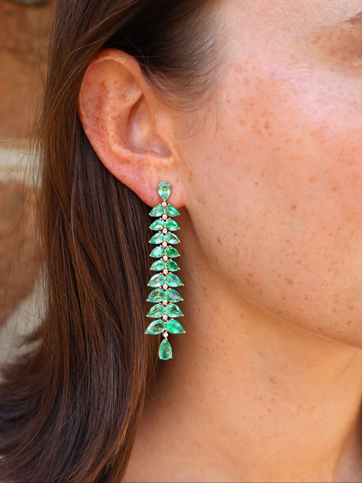 18k below gold pear emerald and diamond shoulder duster long earrings by Goshwara Tiny Gods