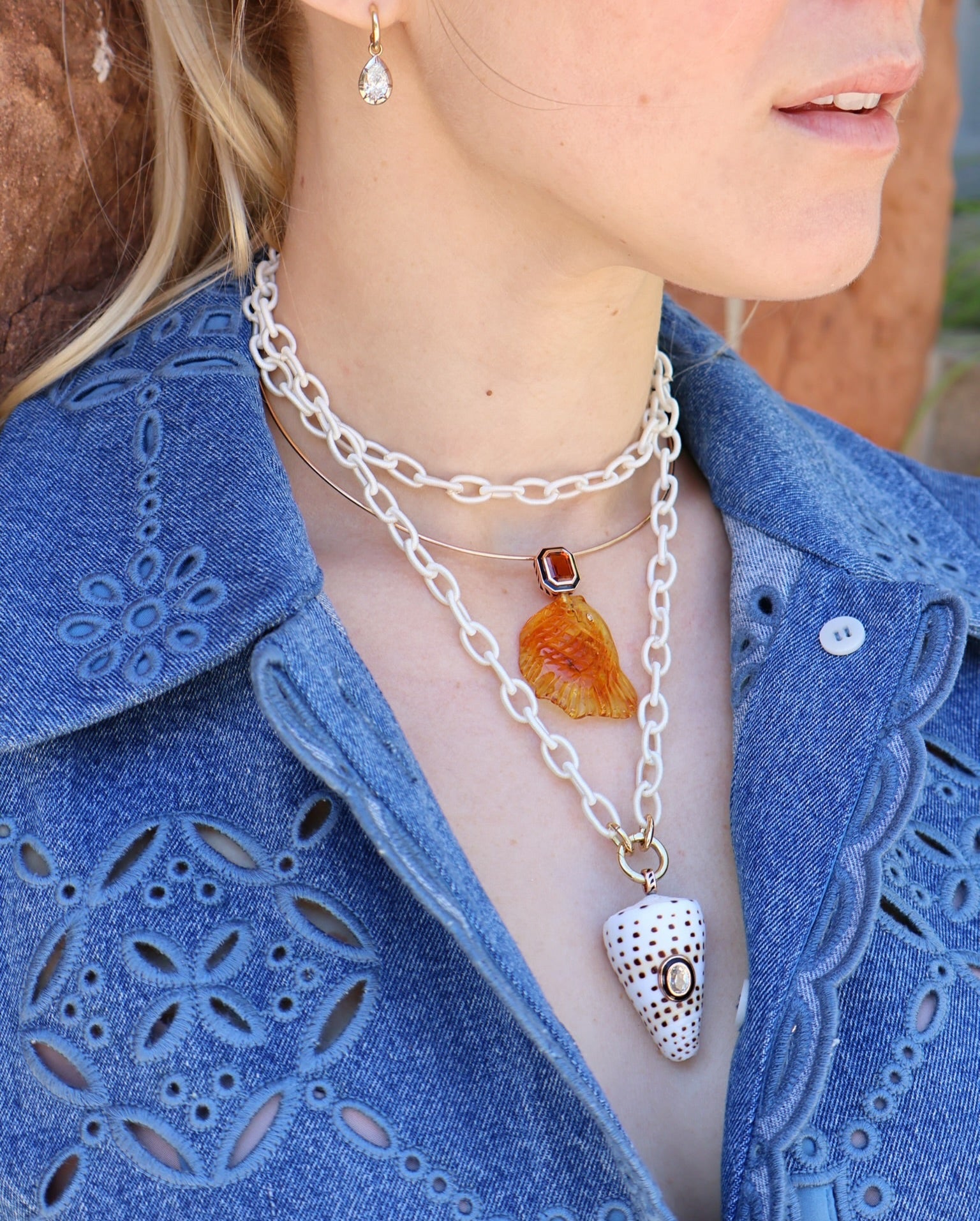18k rose gold carved amber fish pendant with emerald cut citrine in a black enamel bezel setting charm pendant by Dezso Tiny Gods