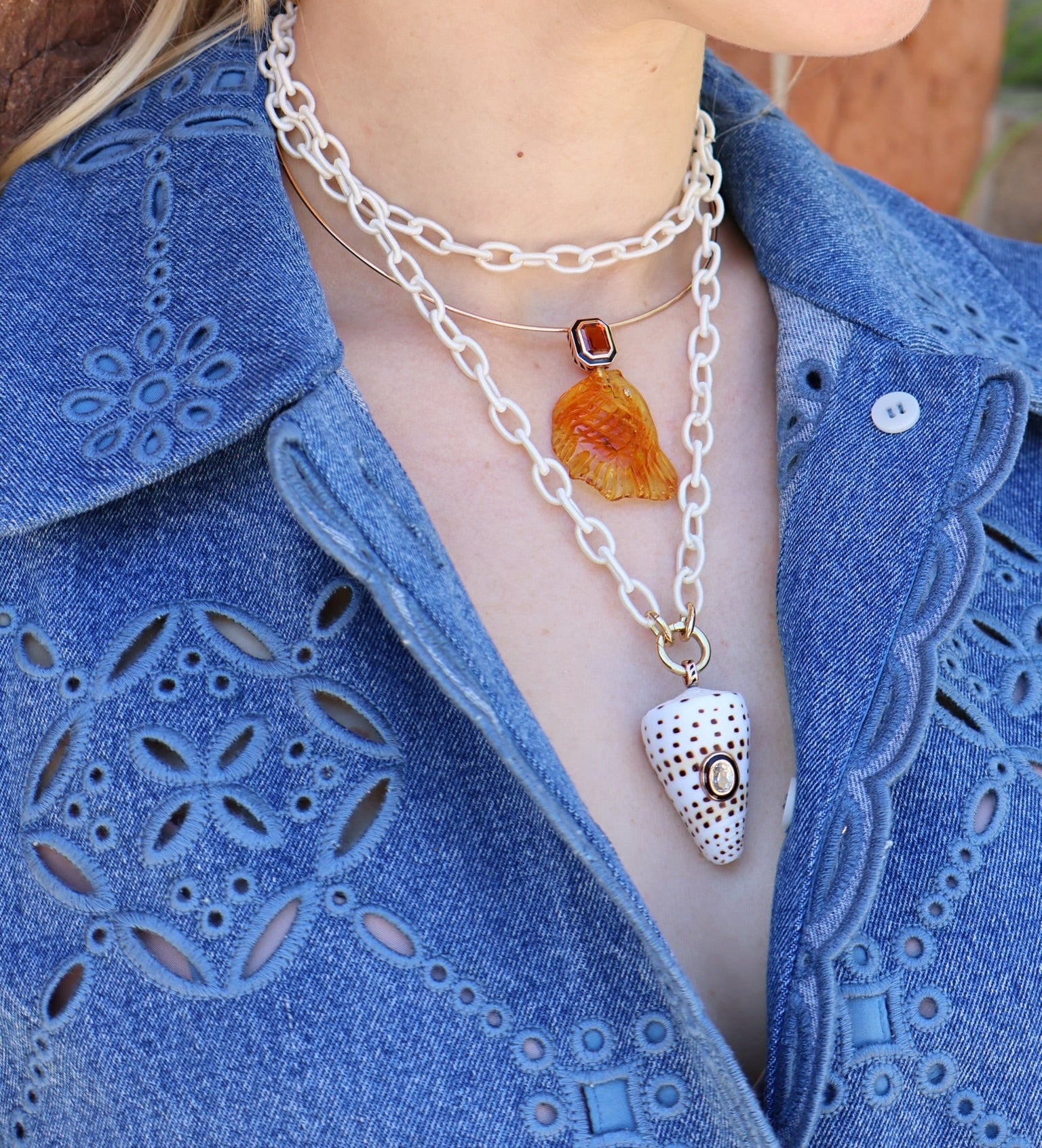 18k rose gold white shell speckled with brown spots with diamond accent with black enamel bezel charm pendant by Dezso Tiny Gods