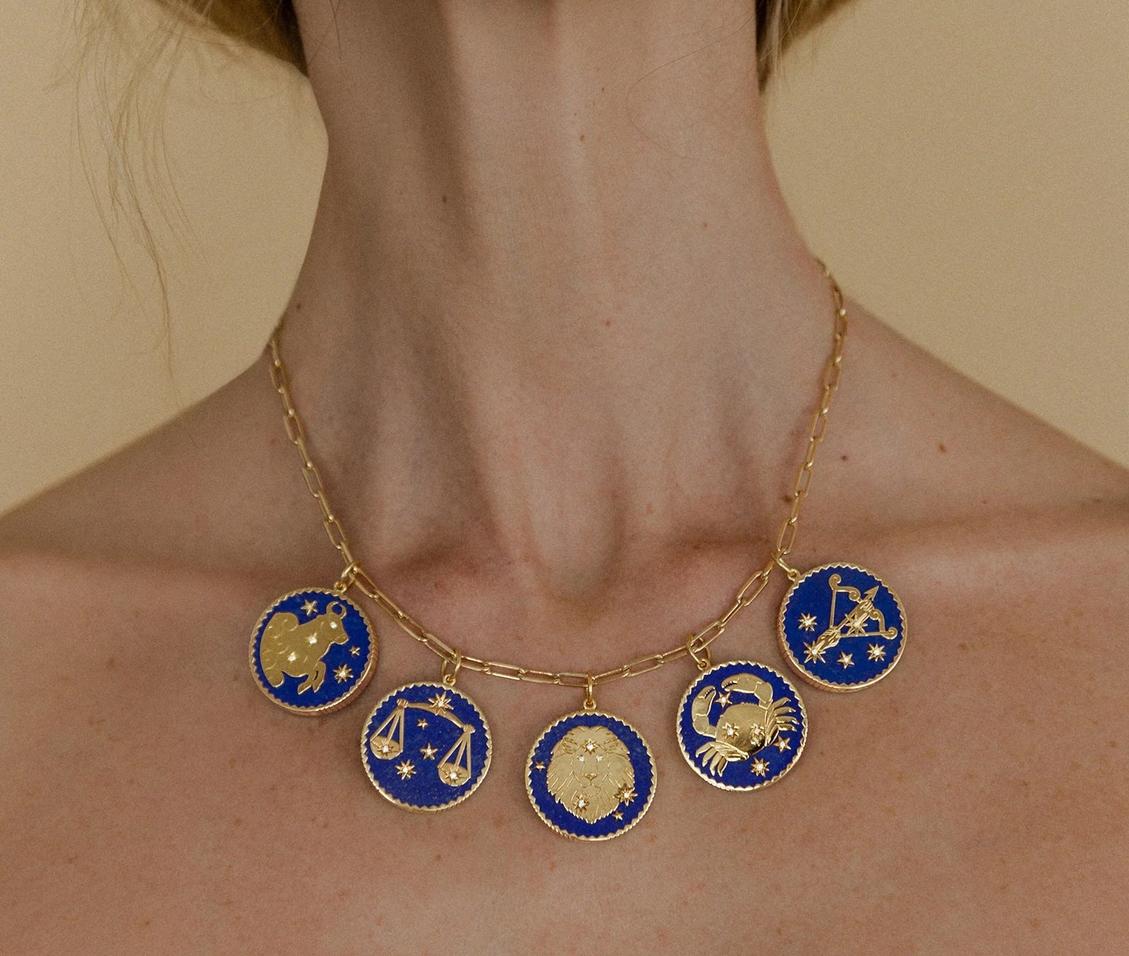 18k yellow gold lapis lazuli pendant with 5 diamonds and Cancer engraving by Sauer