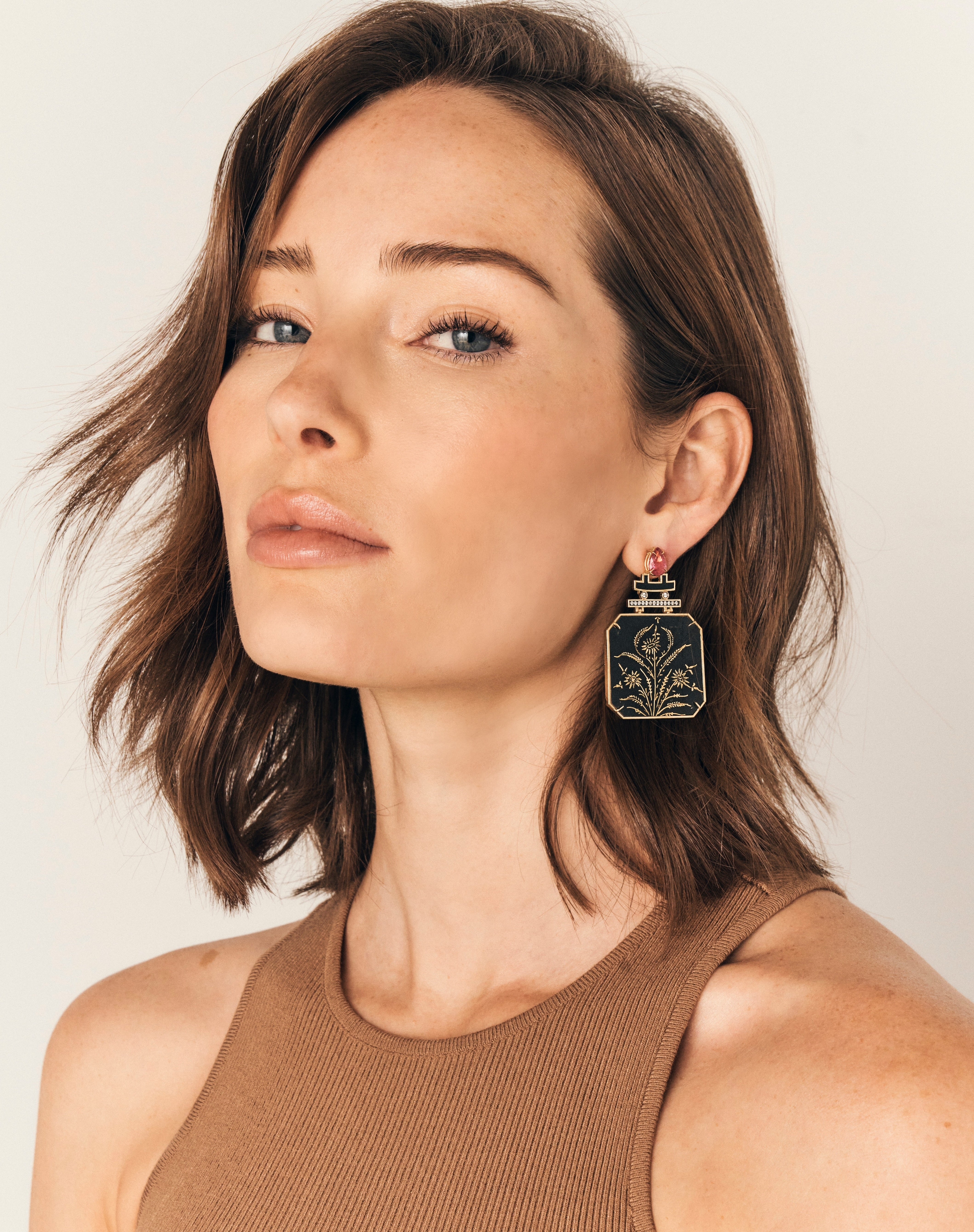 18k yellow gold diamond and pear pink tourmaline paper mache ceramic earrings with hand painted golden flower design by Silvia Furmanovich Tiny Gods on model