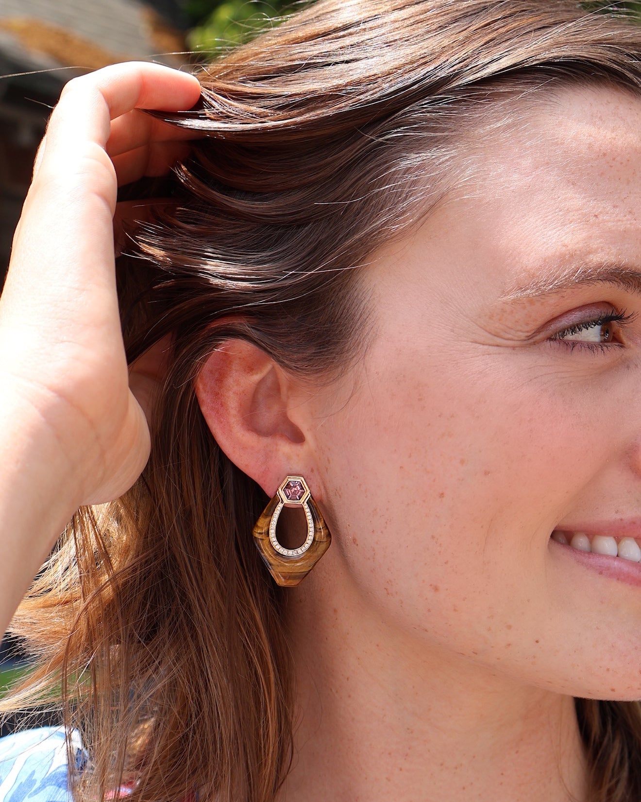18k yellow gold tigers eye nomad doorknocker earrings with pink spinel and diamonds by Sorellina Tiny Gods on model