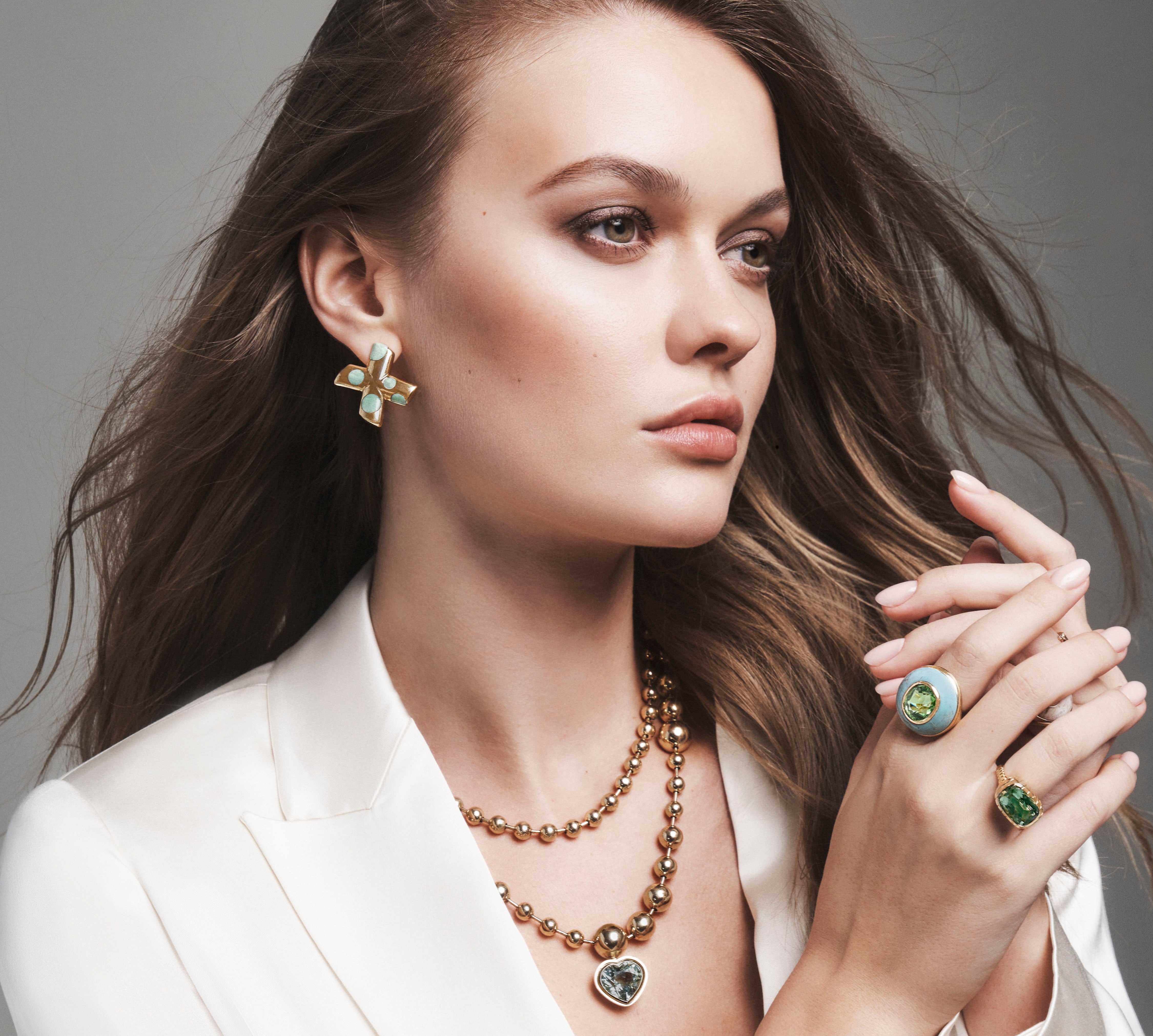 14K yellow gold XO Large Polka Dot XO Earrings in Green Turquoise by Retrouvai at Tiny Gods on model