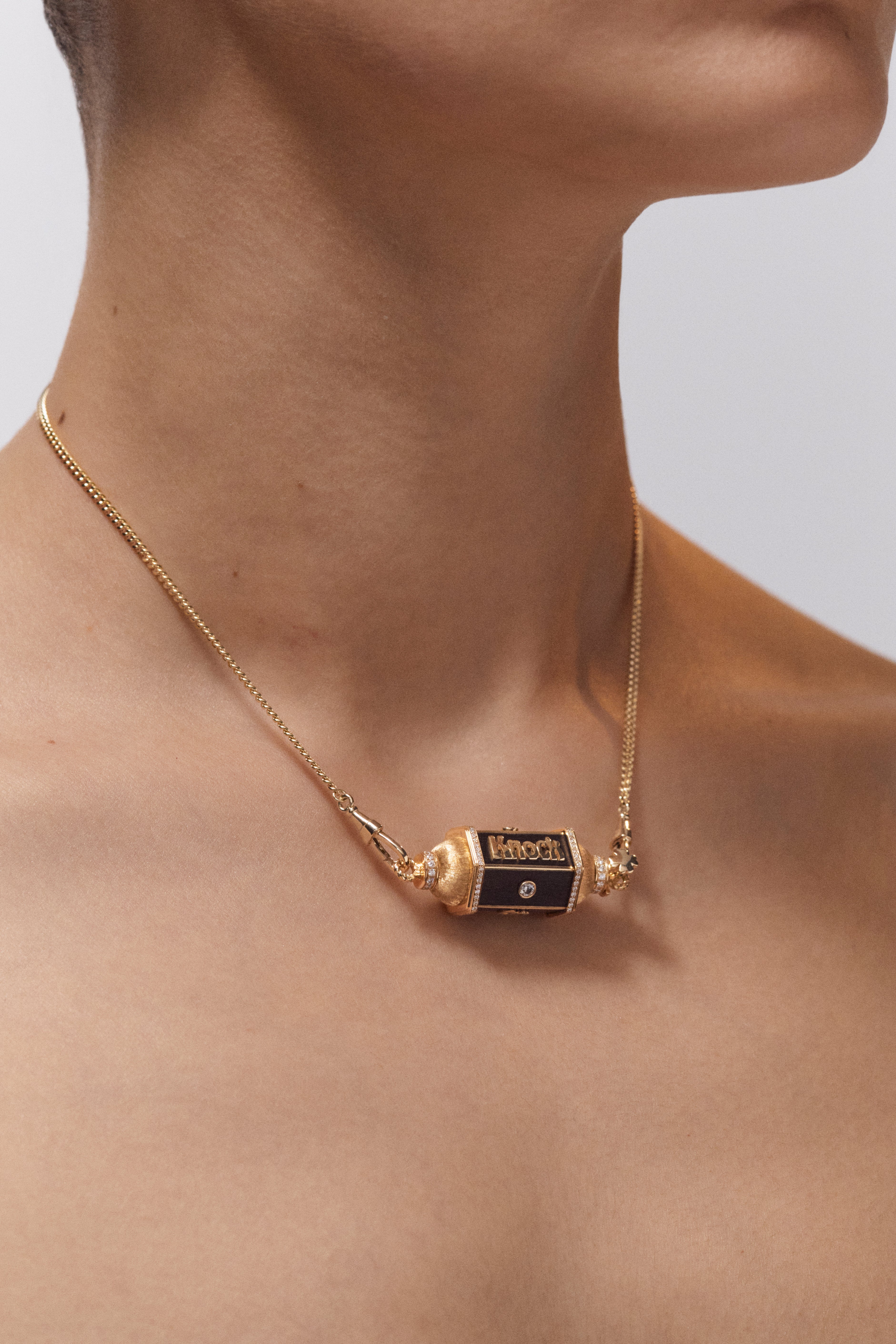 18k yellow gold black ebony wood knock on wood locket pendant necklace by Marie Lichtenberg Tiny Gods