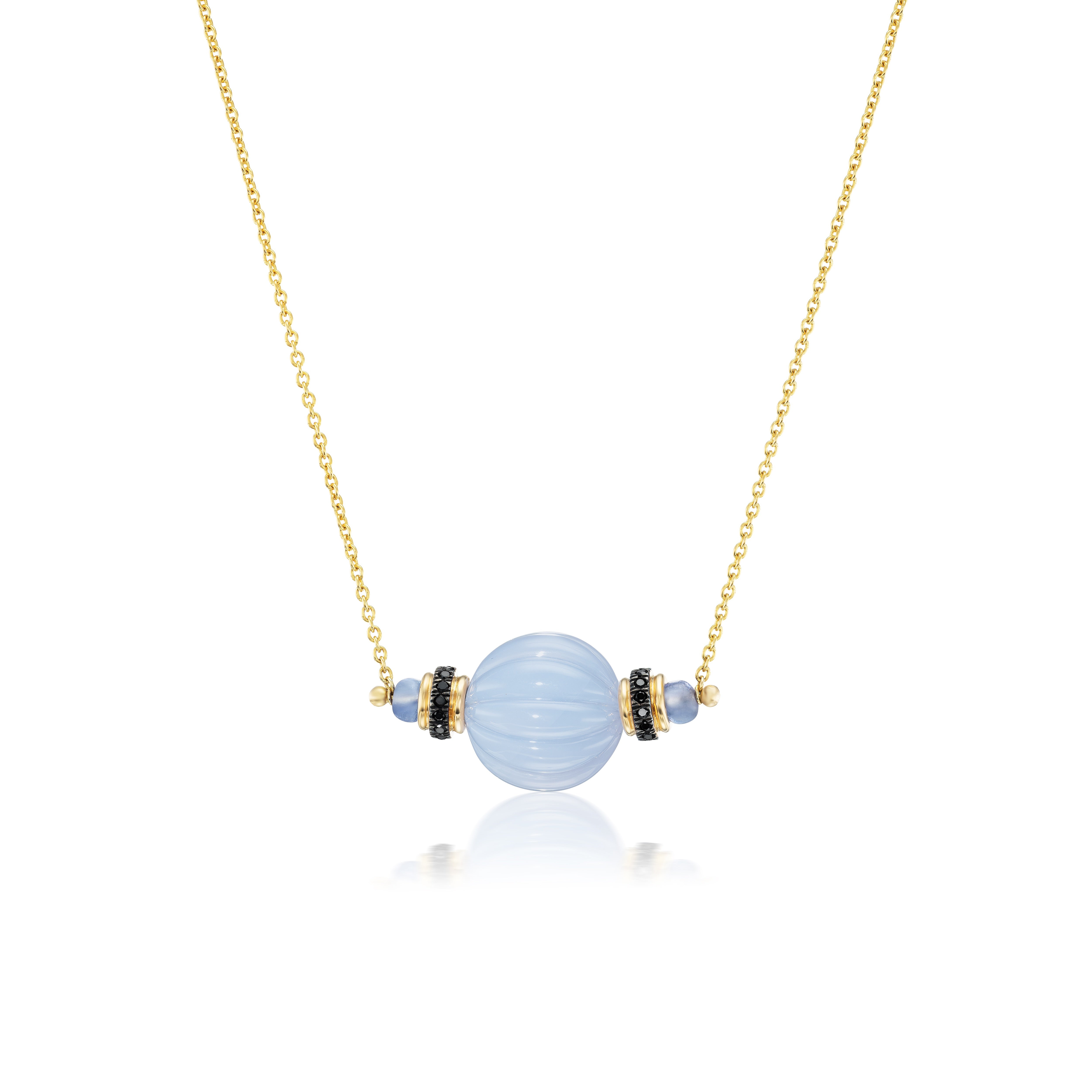 18k yellow gold carved candy chalcedony pendant with black diamonds and tanzanite necklace by Tallin Tiny Gods