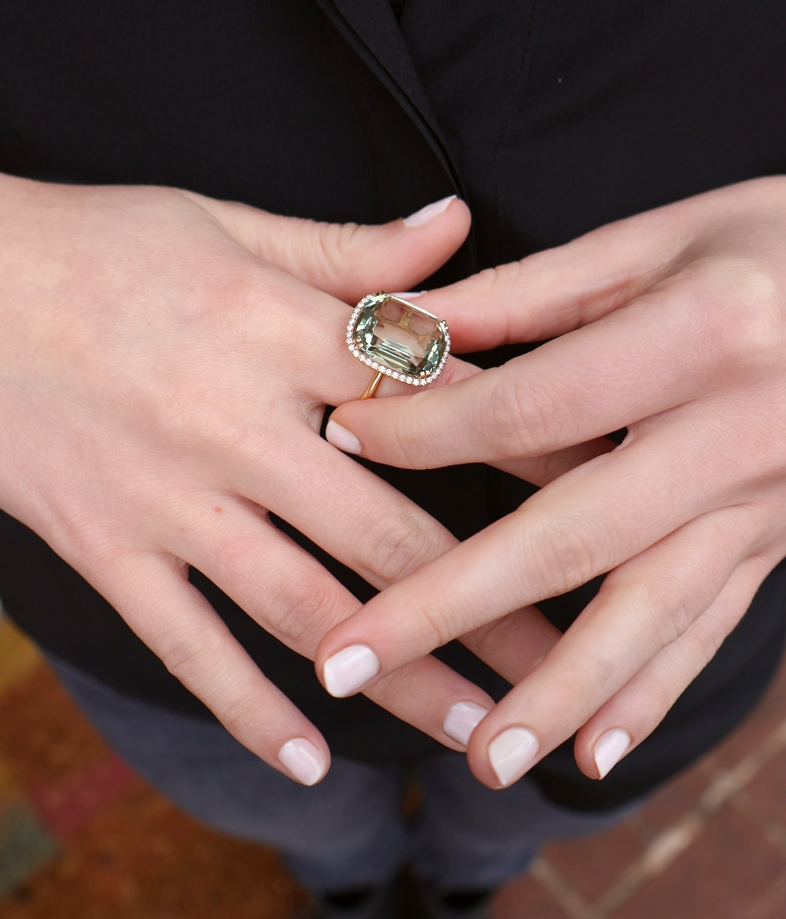 18k yellow gold cushion cut prasioltie with diamond pave border set on a tube shank ring by Goshwara Tiny Gods