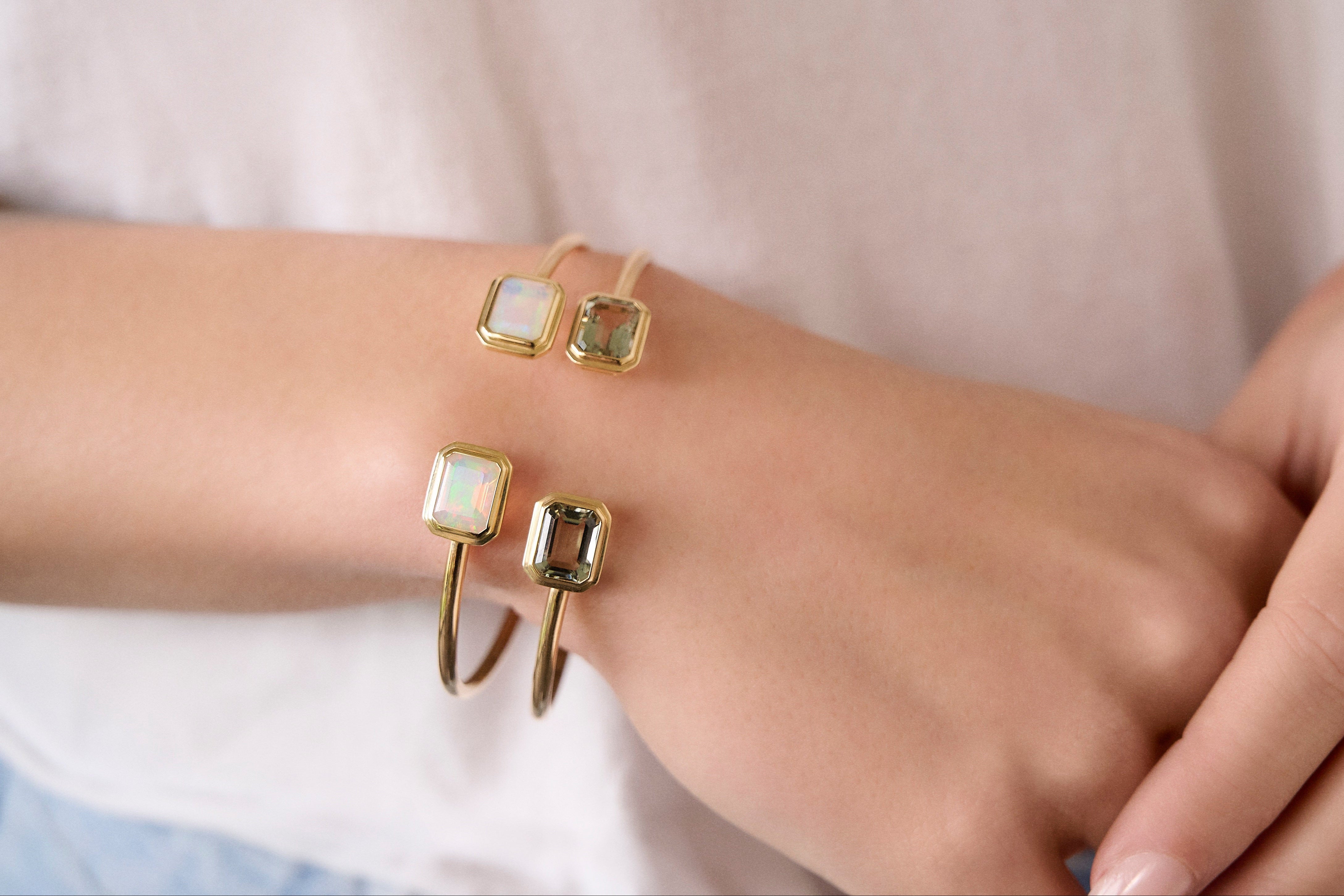 18k yellow gold flexible tube open gap cuff bracelet with emerald cut opal by Goshwara Tiny Gods