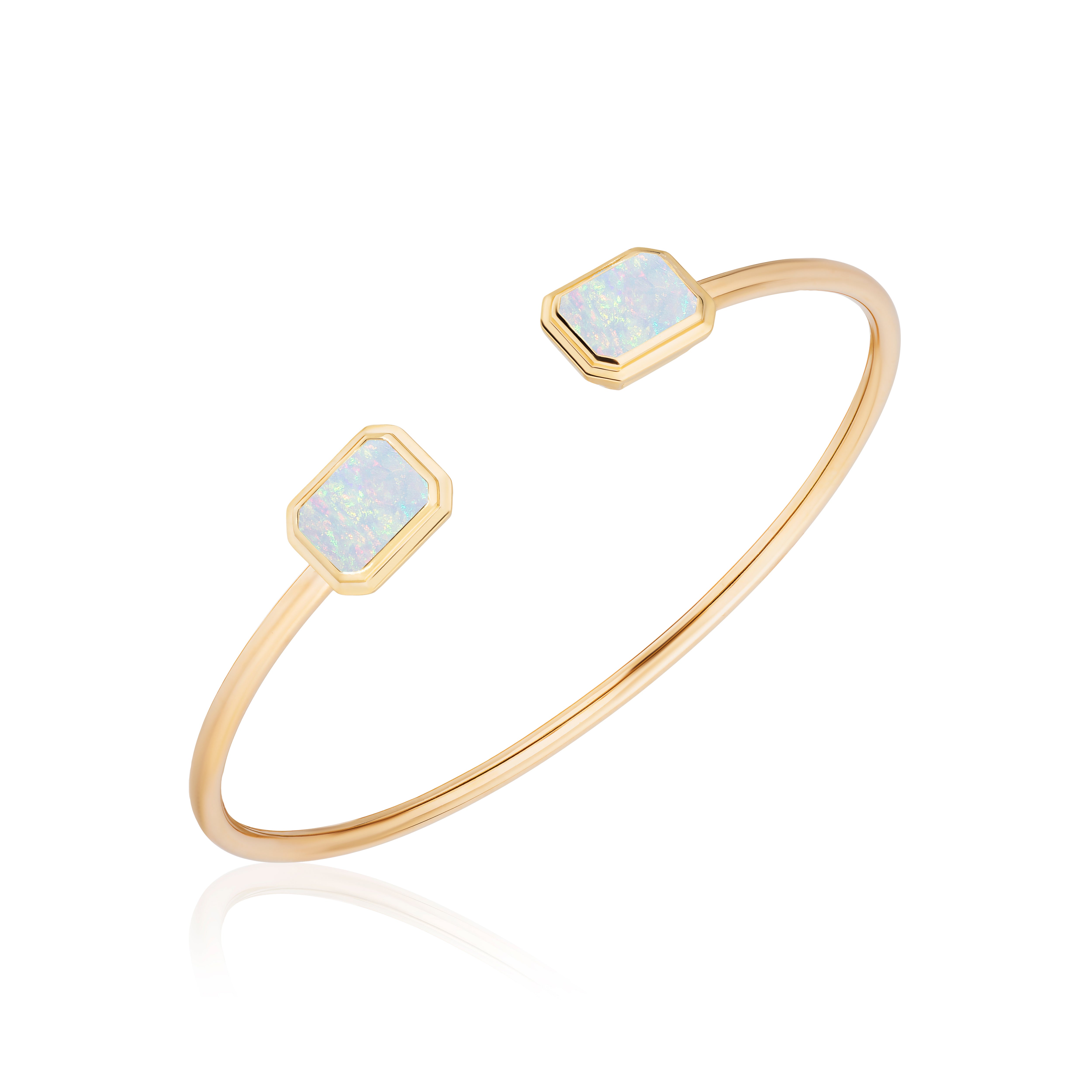 18k yellow gold flexible tube open gap cuff bracelet with emerald cut opal by Goshwara Tiny Gods