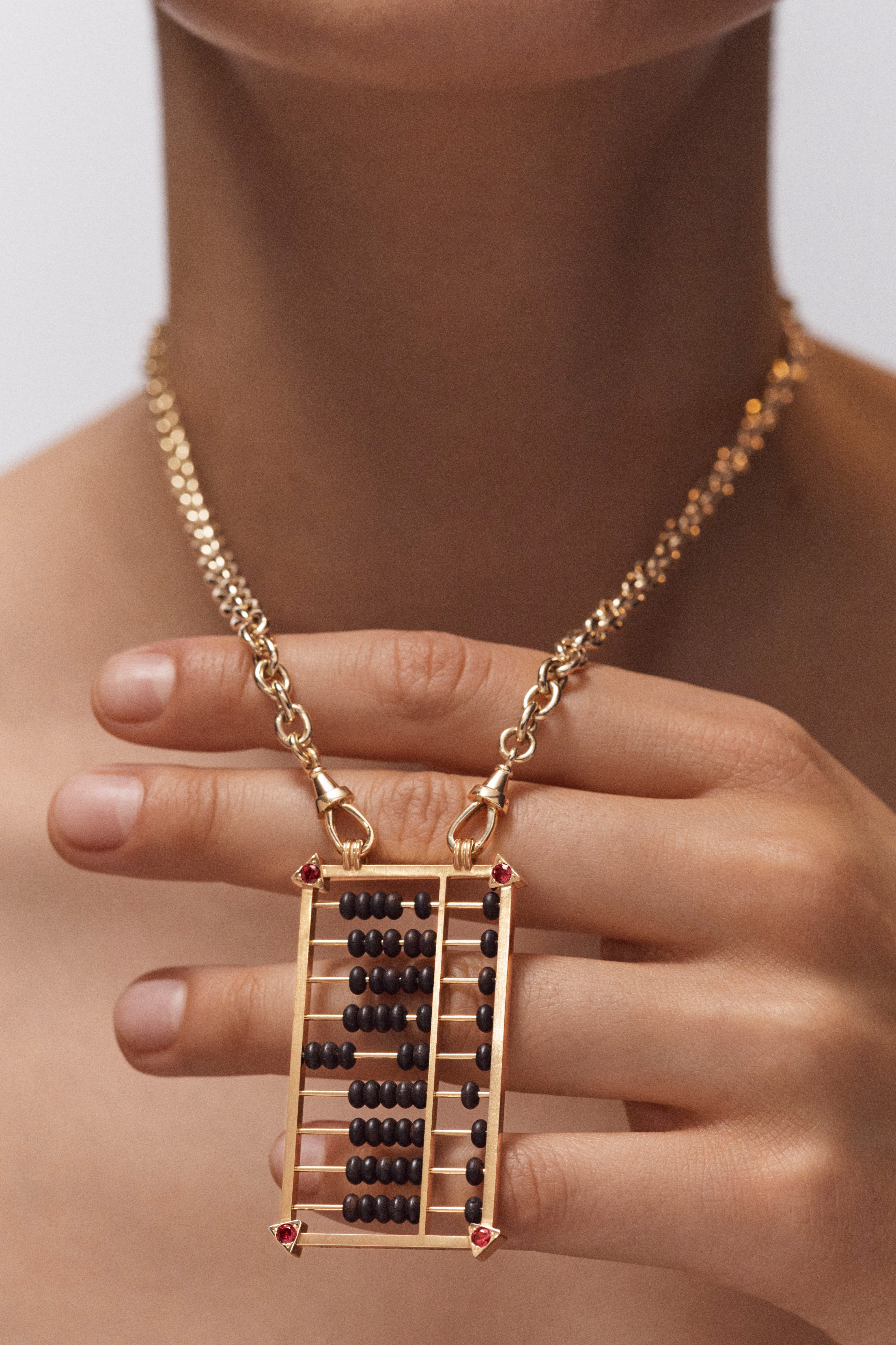 18k yellow gold and ruby black ebony abacus pendant necklace on a rosa classic chain by Marie Lichtenberg Tiny Gods