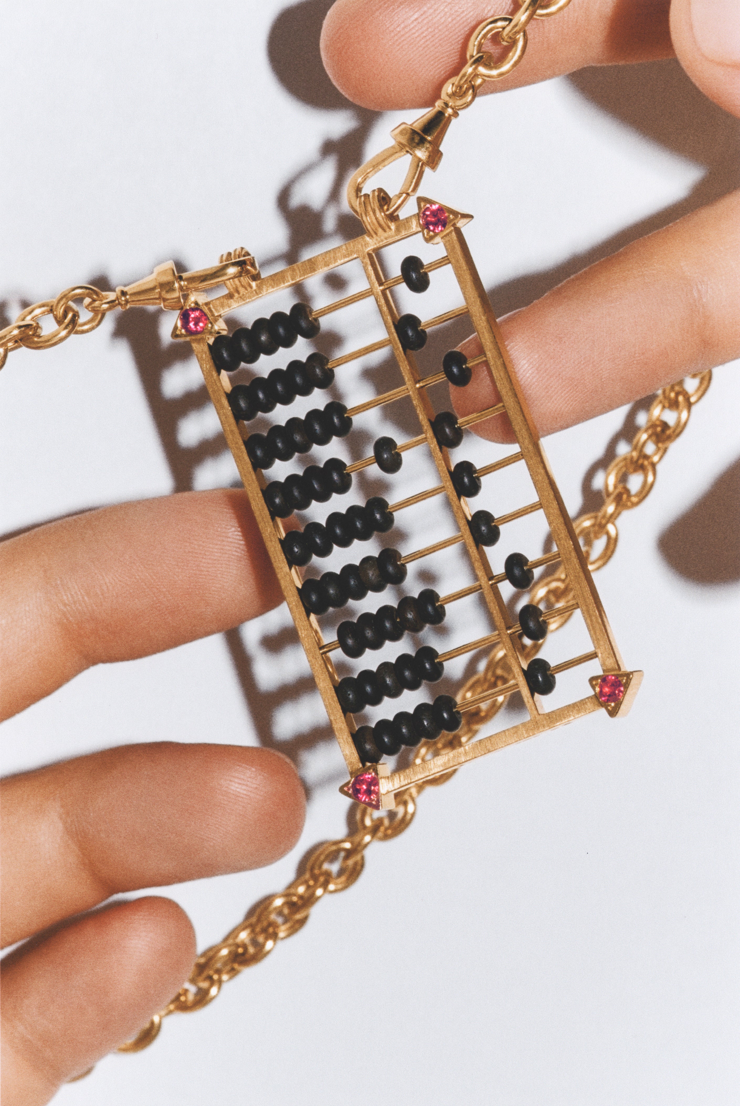 18k yellow gold and ruby black ebony abacus pendant necklace on a rosa classic chain by Marie Lichtenberg Tiny Gods