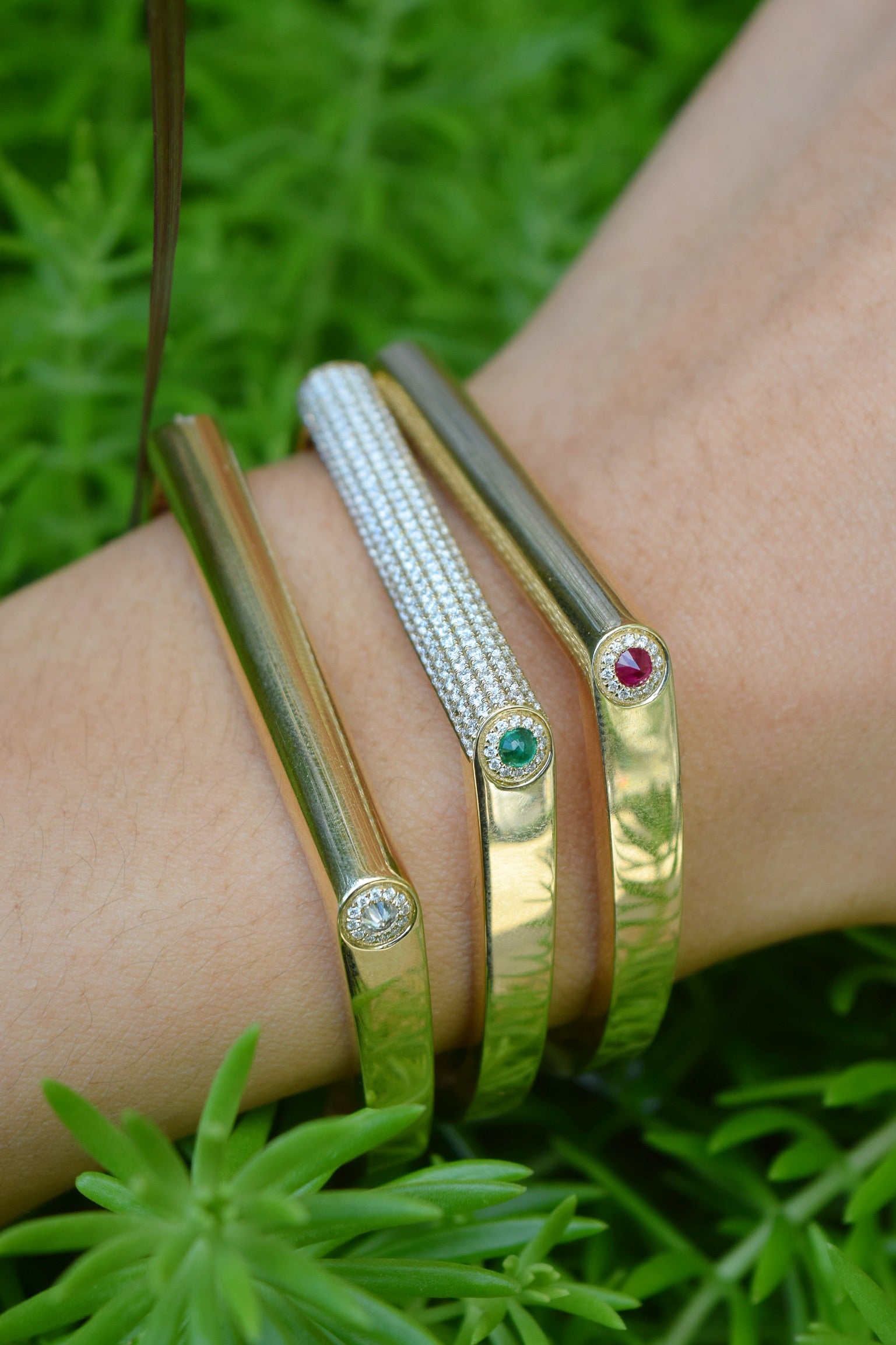 14k yellow gold Grace bangles with diamonds by Rainbow K Tiny Gods on model