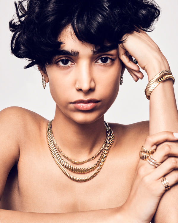 18k yellow gold Anita Ko jewelry necklaces bracelets on model tiny gods