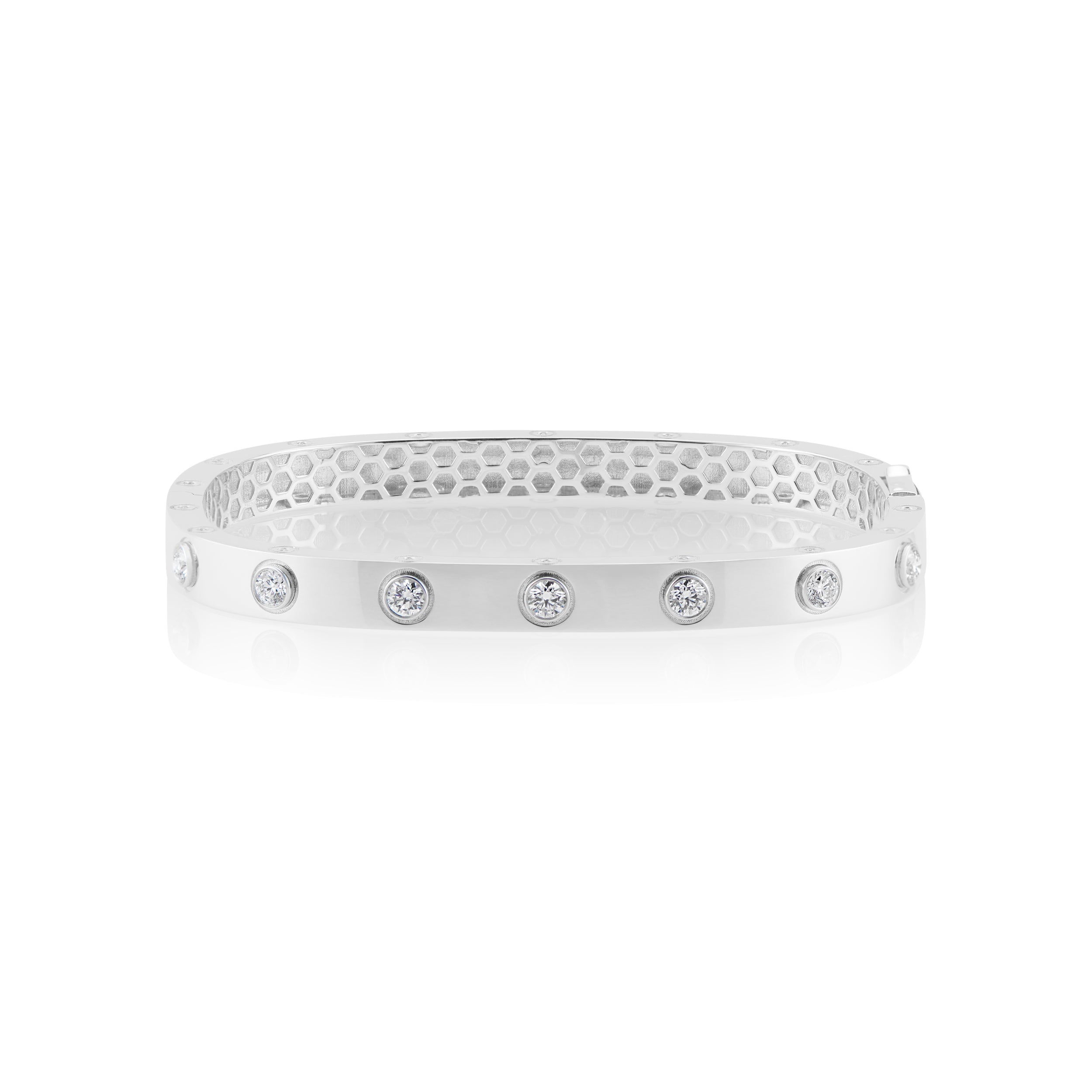 18k gold bangle with bezel set diamonds by Tiny Gods