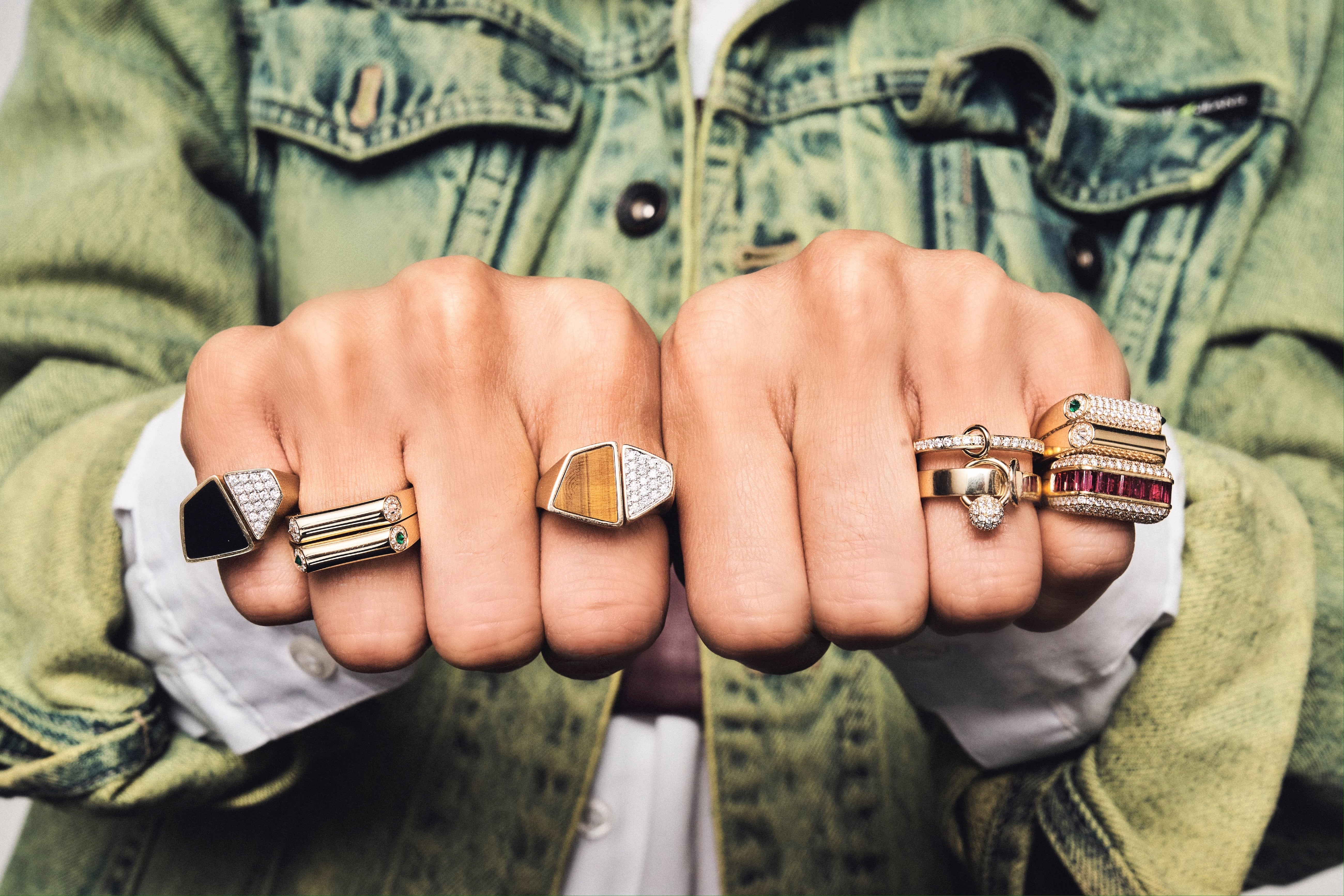 rainbow K rings on model tiny gods yellow gold