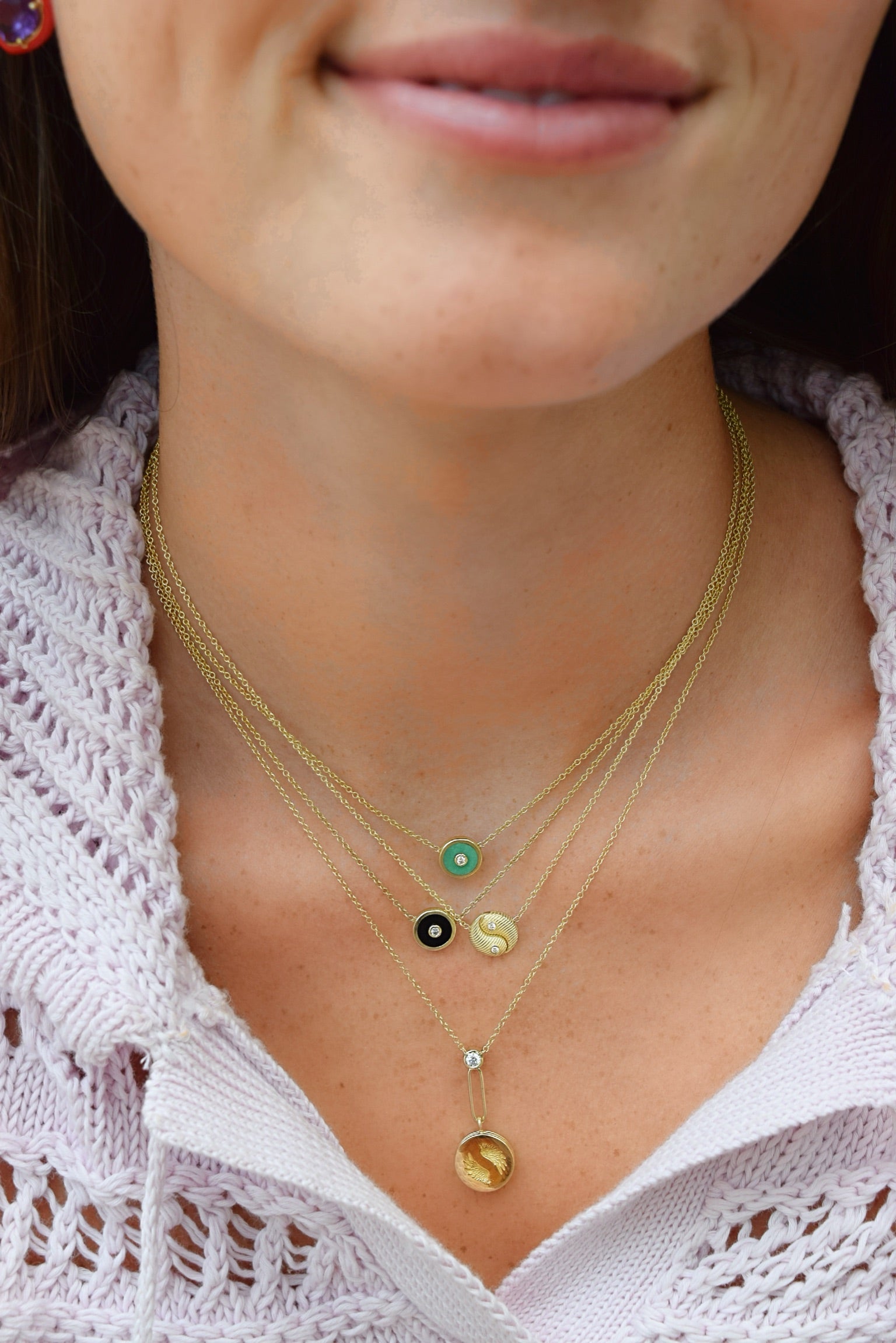 18k yellow gold mini compass pendant with black onyx and diamond by Retouvai on model