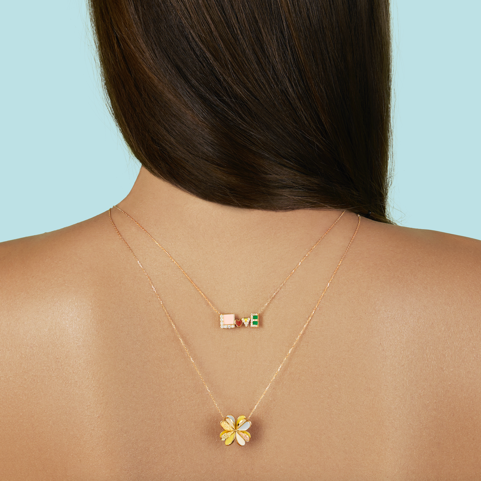 18k yellow gold with yellow, white and blue enamel petals with semi-precious stones Lucky You Necklace by Aisha Baker Tiny Gods on model