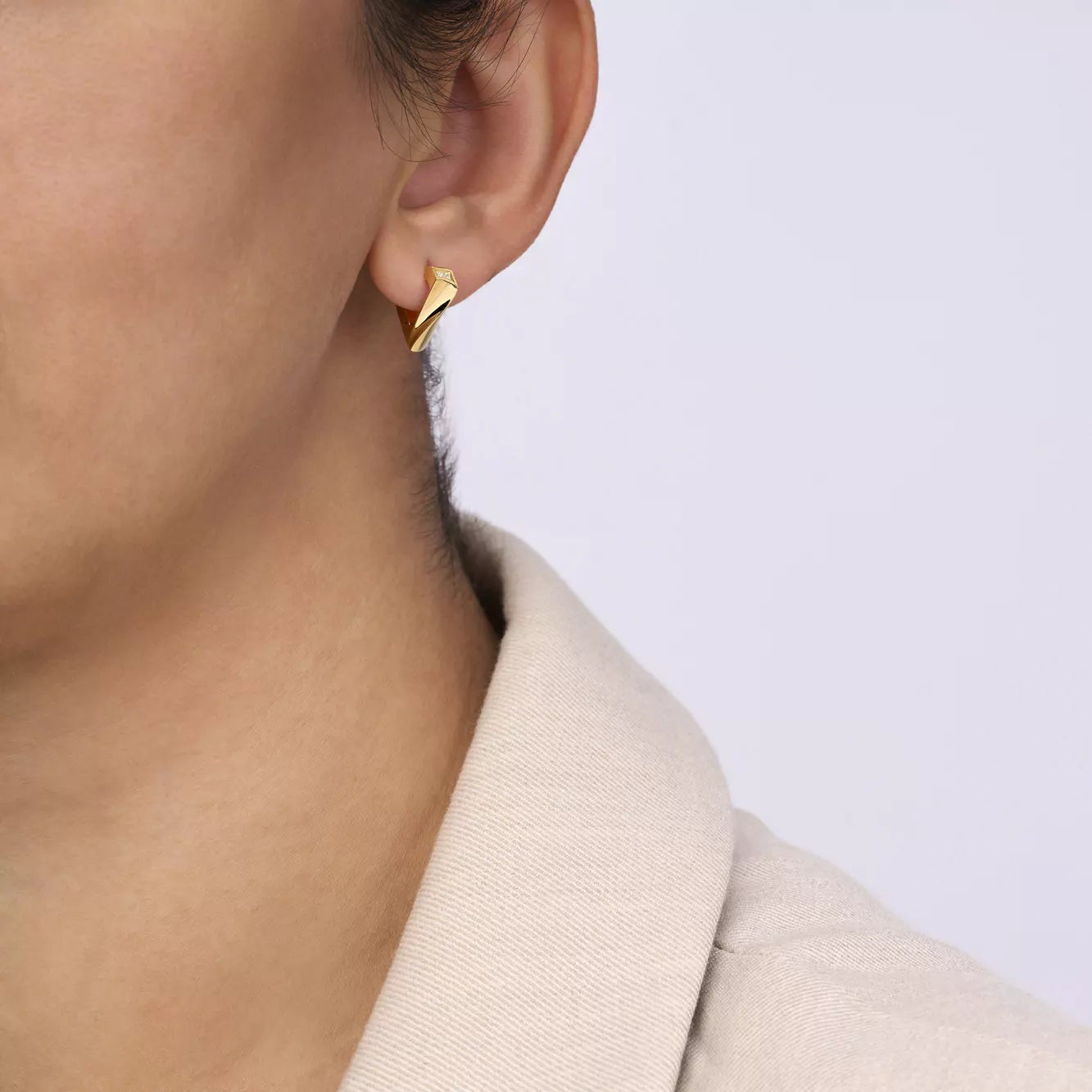 18k yellow gold small brute flux huggie earrings by Dries Criel Tiny Gods 
