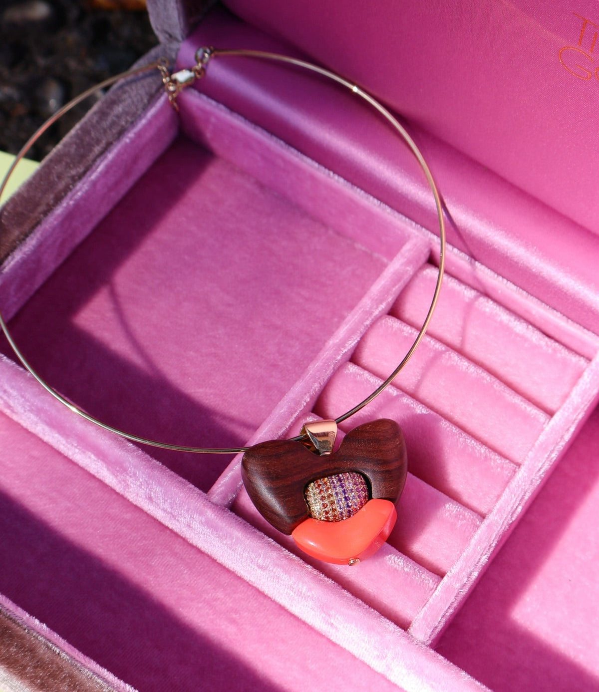 18k yellow gold ebony wood heart totem pendant with rainbow sapphire and coral elements by Joelle Kharrat Tiny Gods 
