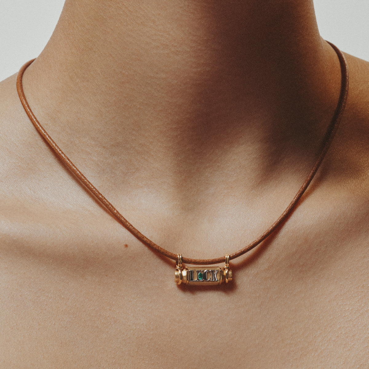 18k yellow gold emerald luck smash locket leather cord necklace by Marie Lichtenberg Tiny Gods