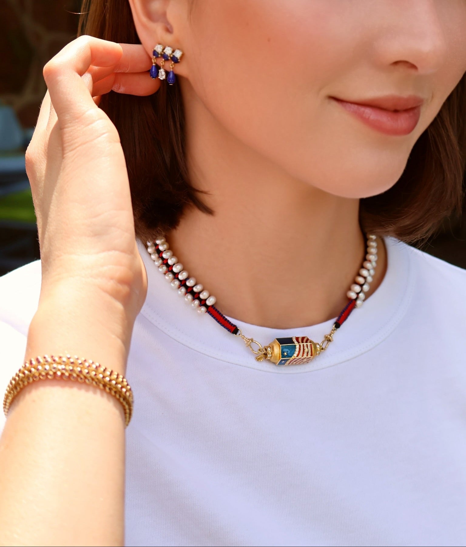 18k yellow gold diamond red white and blue USA enamel star stripe flag locket with pearl red and navy Mauli cord by Marie Lichtenberg Tiny Gods 