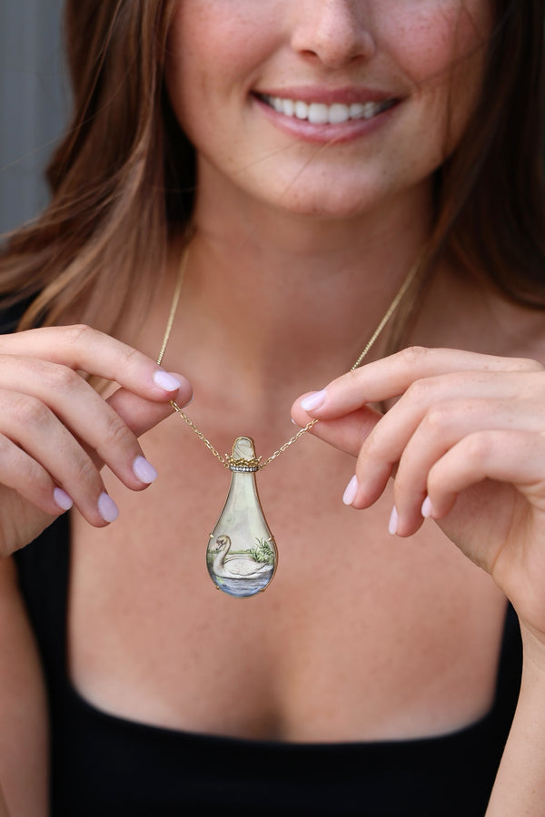 18k yellow gold swan print miniature painting necklace in a bottle by Silvia Furmanovich Tiny Gods