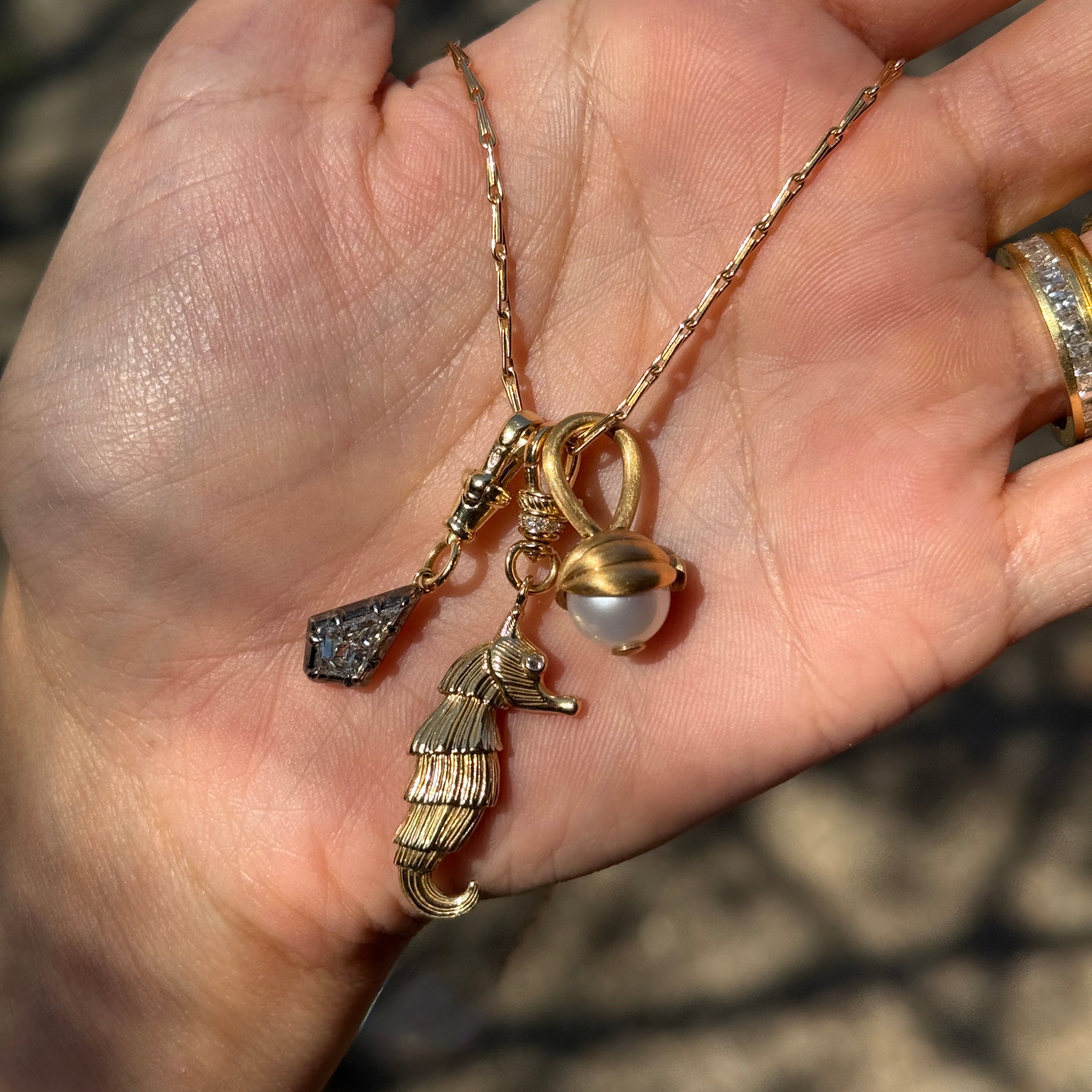 14k yellow gold pot belly seahorse charm pendant by Lucy Delius Tiny Gods 