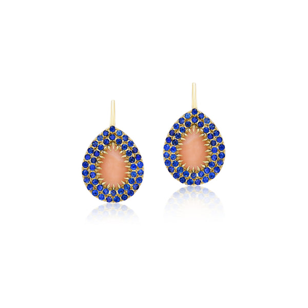 18k yellow gold claw prong set pear shaped drop earrings with blue sapphires and ethically sourced peach coral on French wire at tiny gods