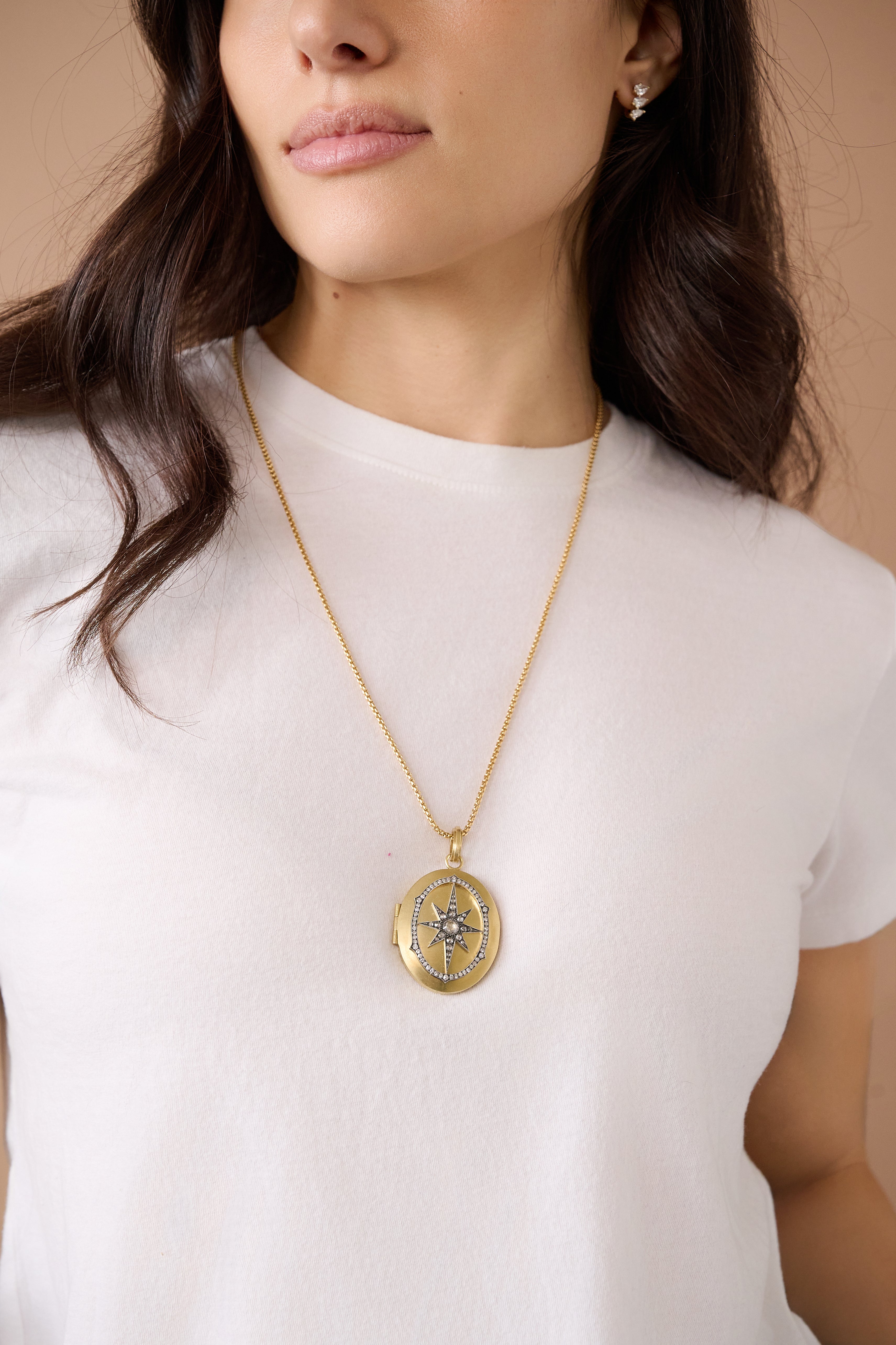 18k yellow gold diamond star starburst antique locket pendant by Sylva & Cie Tiny Gods on model