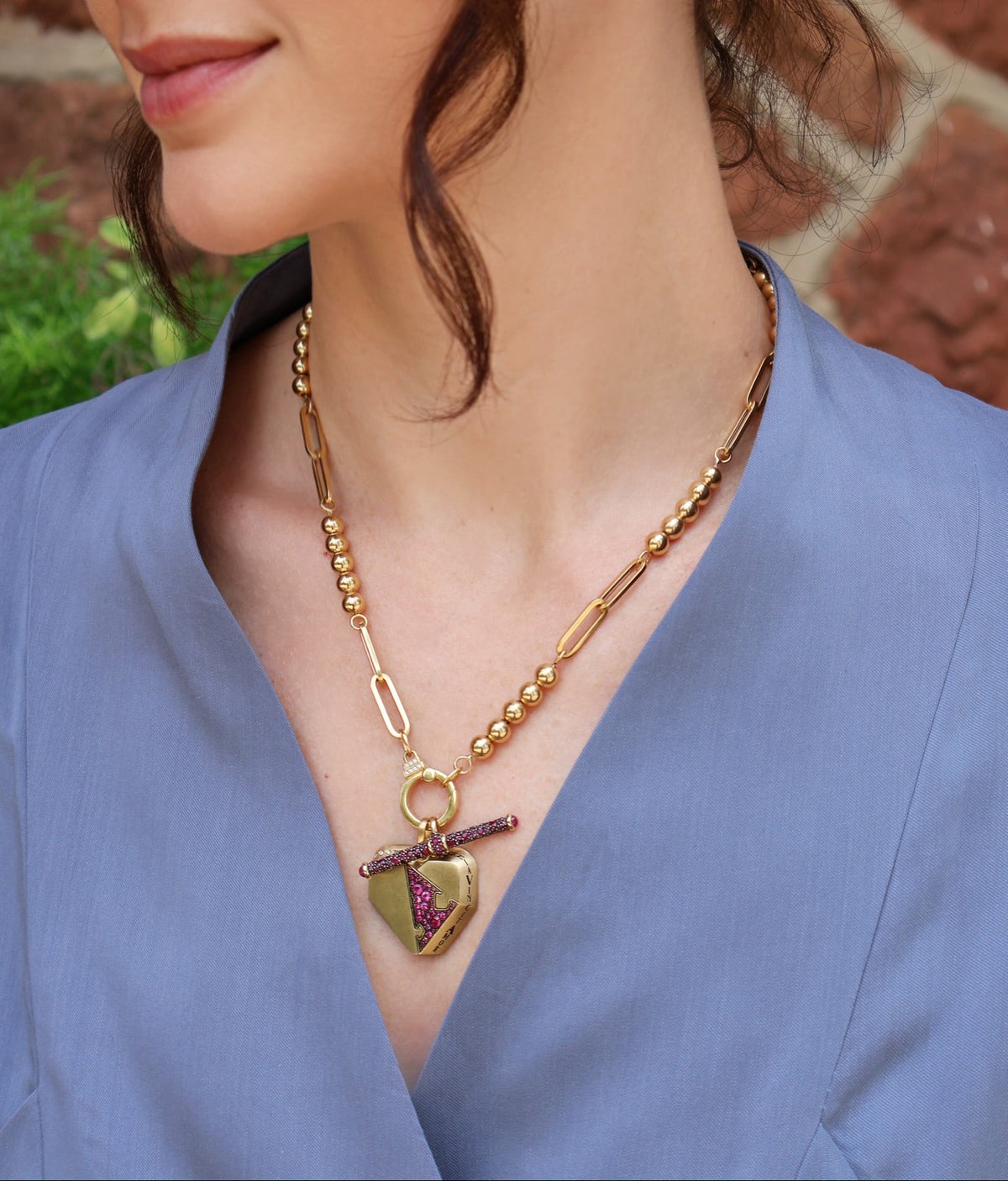 18k yellow gold ruby puzzle piece heart pendant with omnia vincit amor love conquers all, love and victory charm, puzzle talisman collection by Circa 1700 Tiny Gods 
