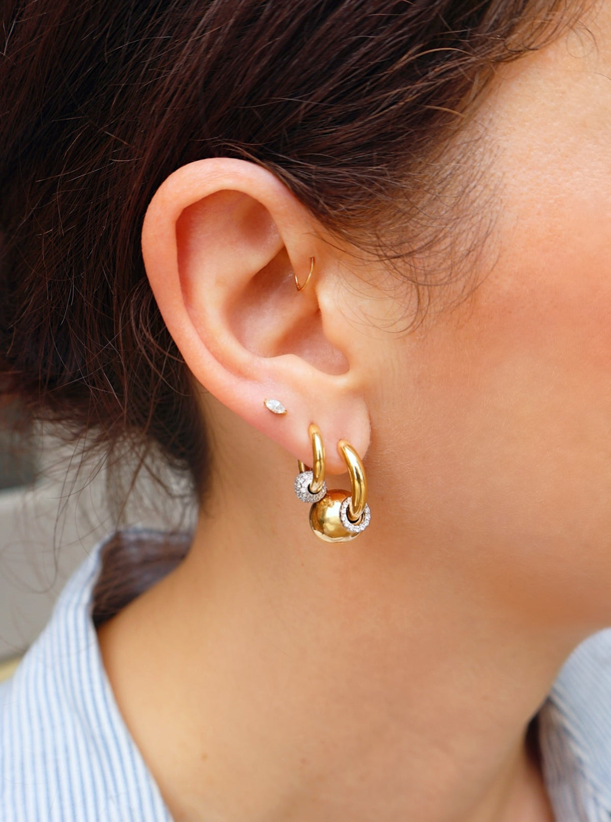 14k yellow gold Huggies with diamond ball piercing earrings by Rainbow K Tiny Gods