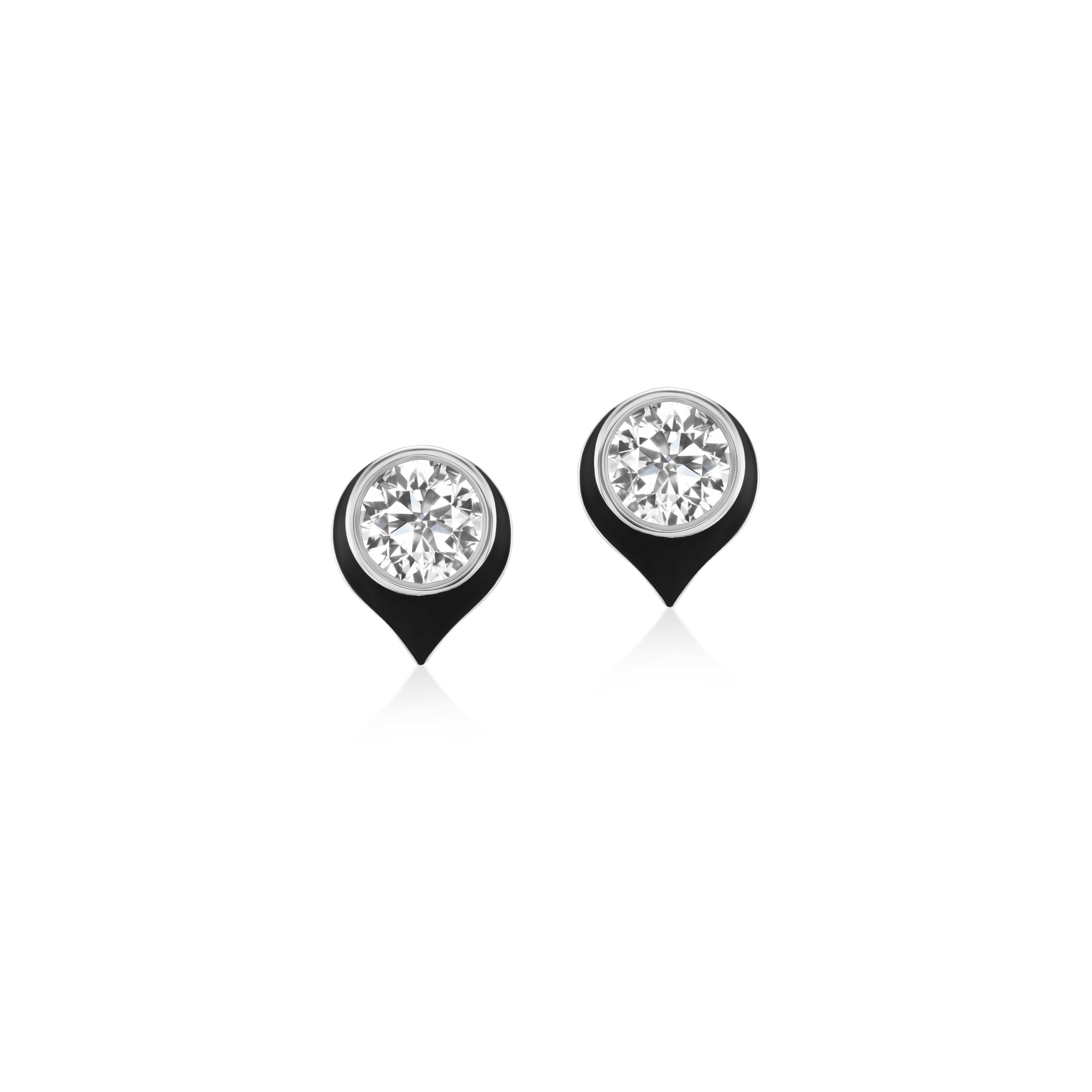 A pair of white gold stud earrings with round-cut diamond  in a teardrop-shaped setting with black enamel