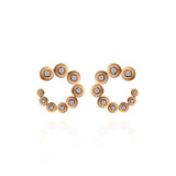 18k yellow gold surrounding small circle earrings with diamonds and petrified wood by Fernando Jorge Tiny Gods