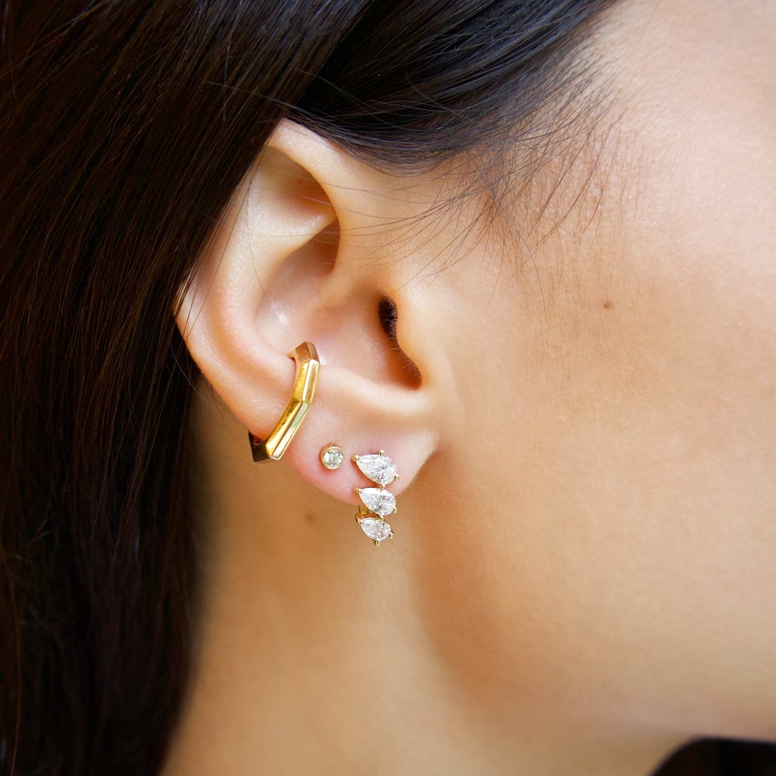 18k yellow gold triple pear diamond curved stud stacked earring by Tiny Gods 