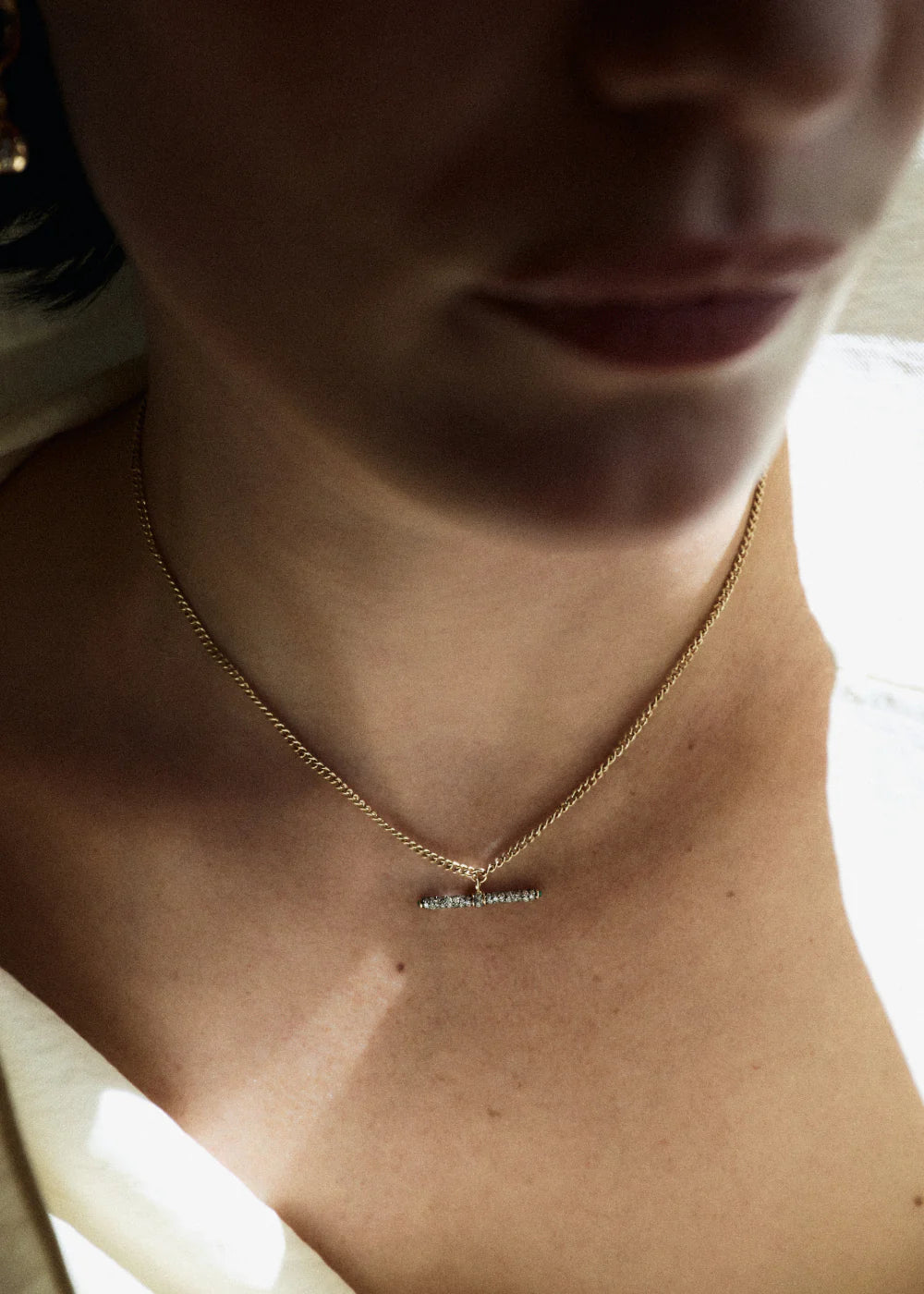 14k yellow gold diamond pave tiny t-bar pendant necklace by Lucy Delius Tiny Gods 