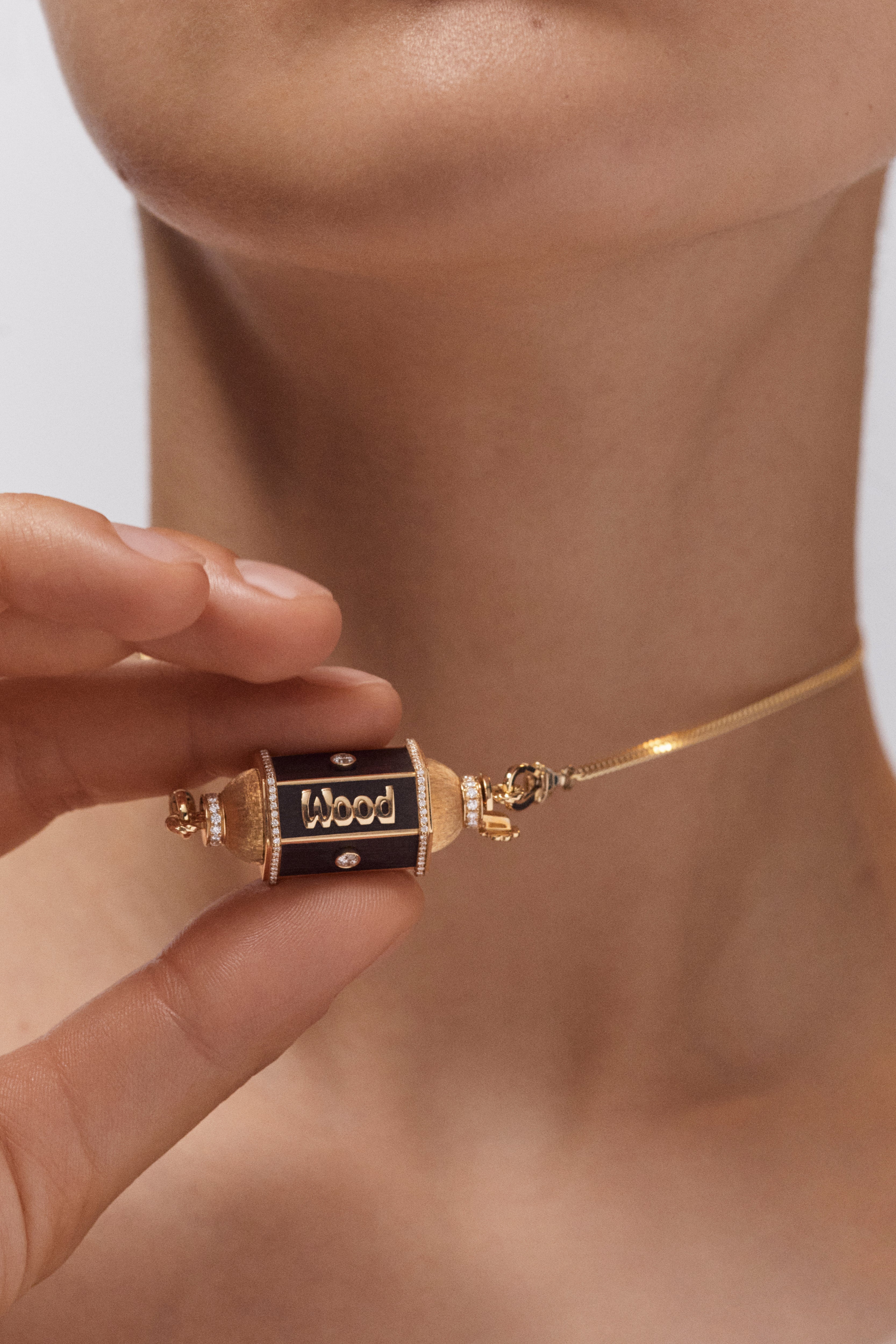 18k yellow gold black ebony wood knock on wood locket pendant necklace by Marie Lichtenberg Tiny Gods 