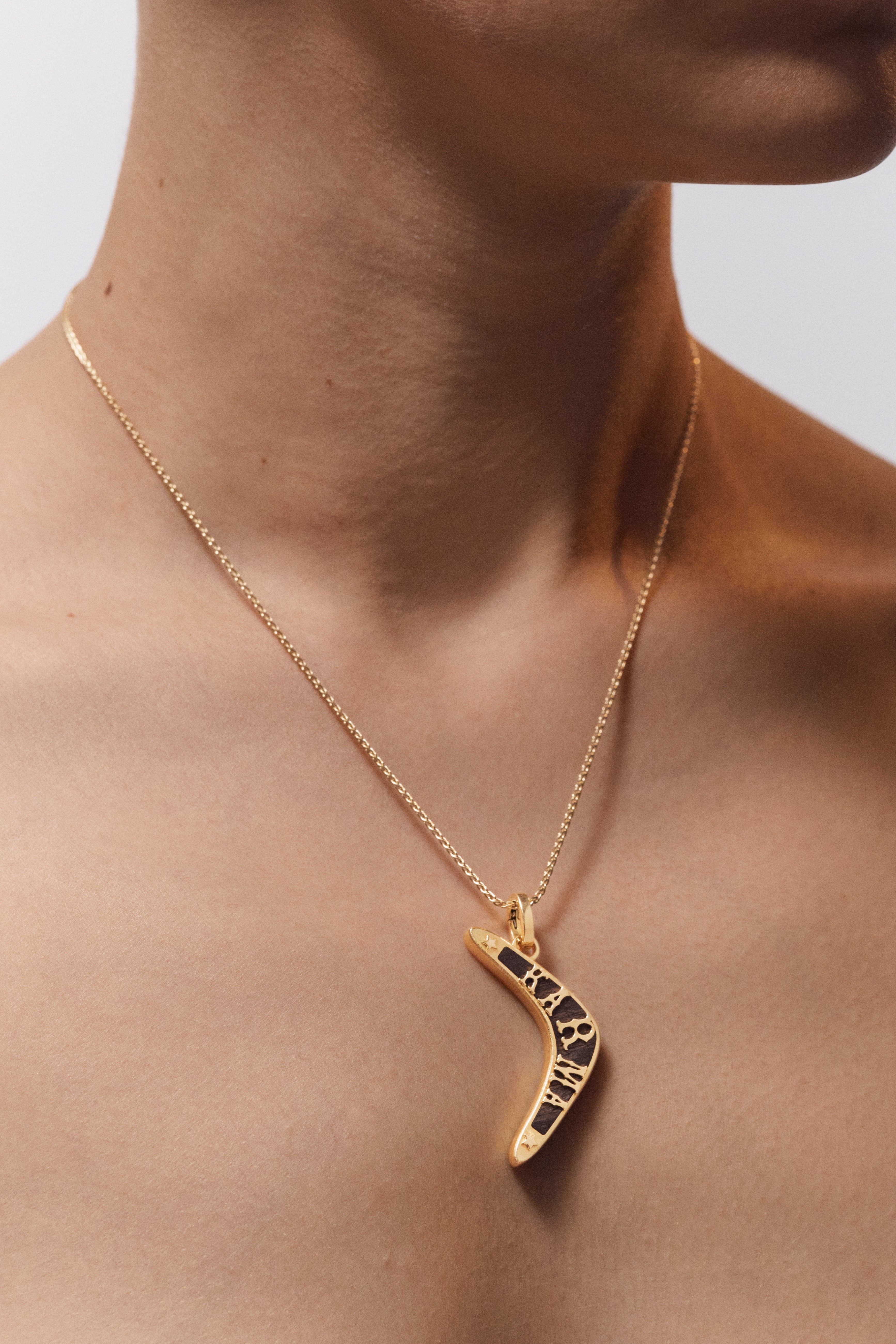 18k yellow gold black ebony wood karma boomerang pendant charm by Marie Lichtenberg Tiny Gods 