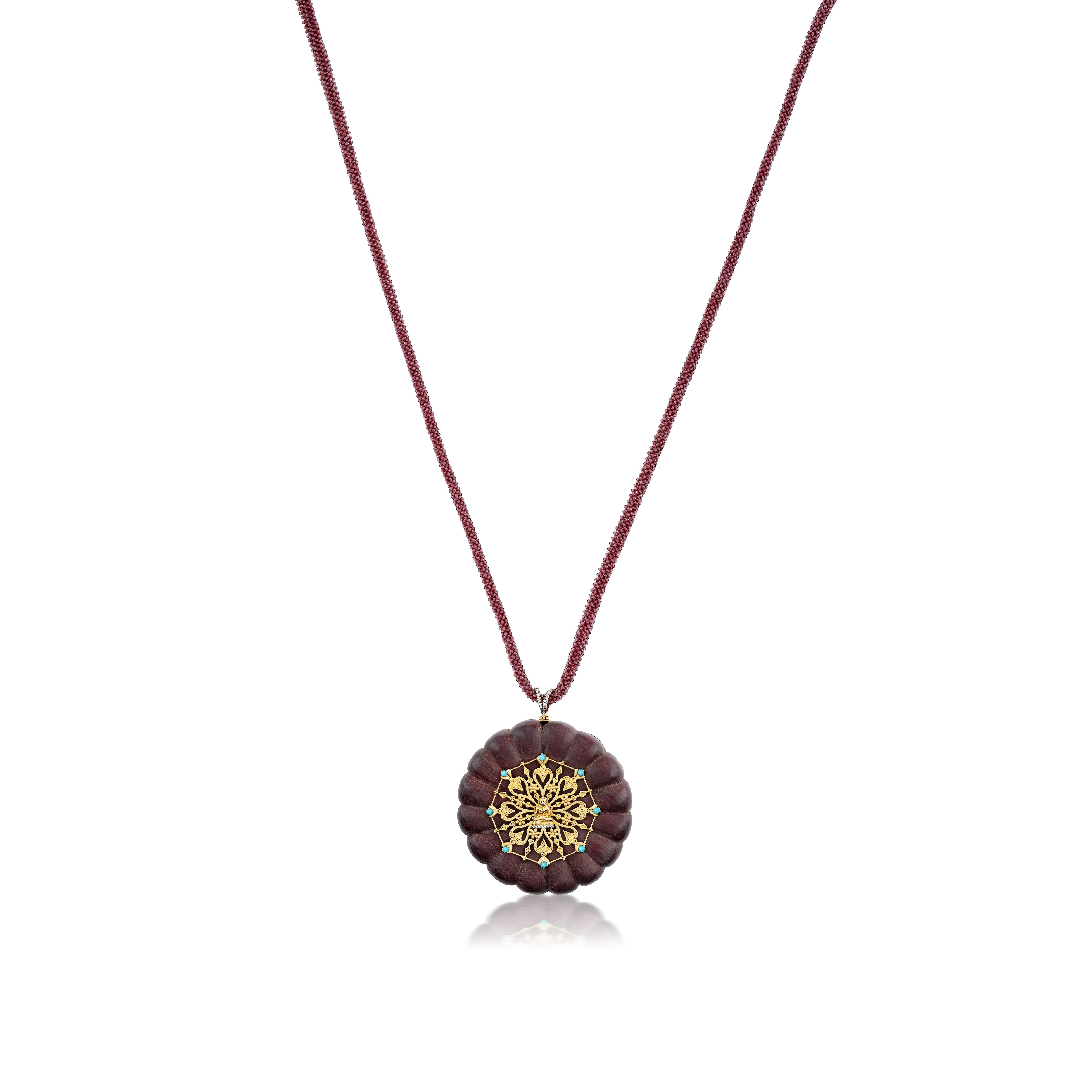 Carved Flower Buddha Medallion Pendant with a Rhodolite Braid