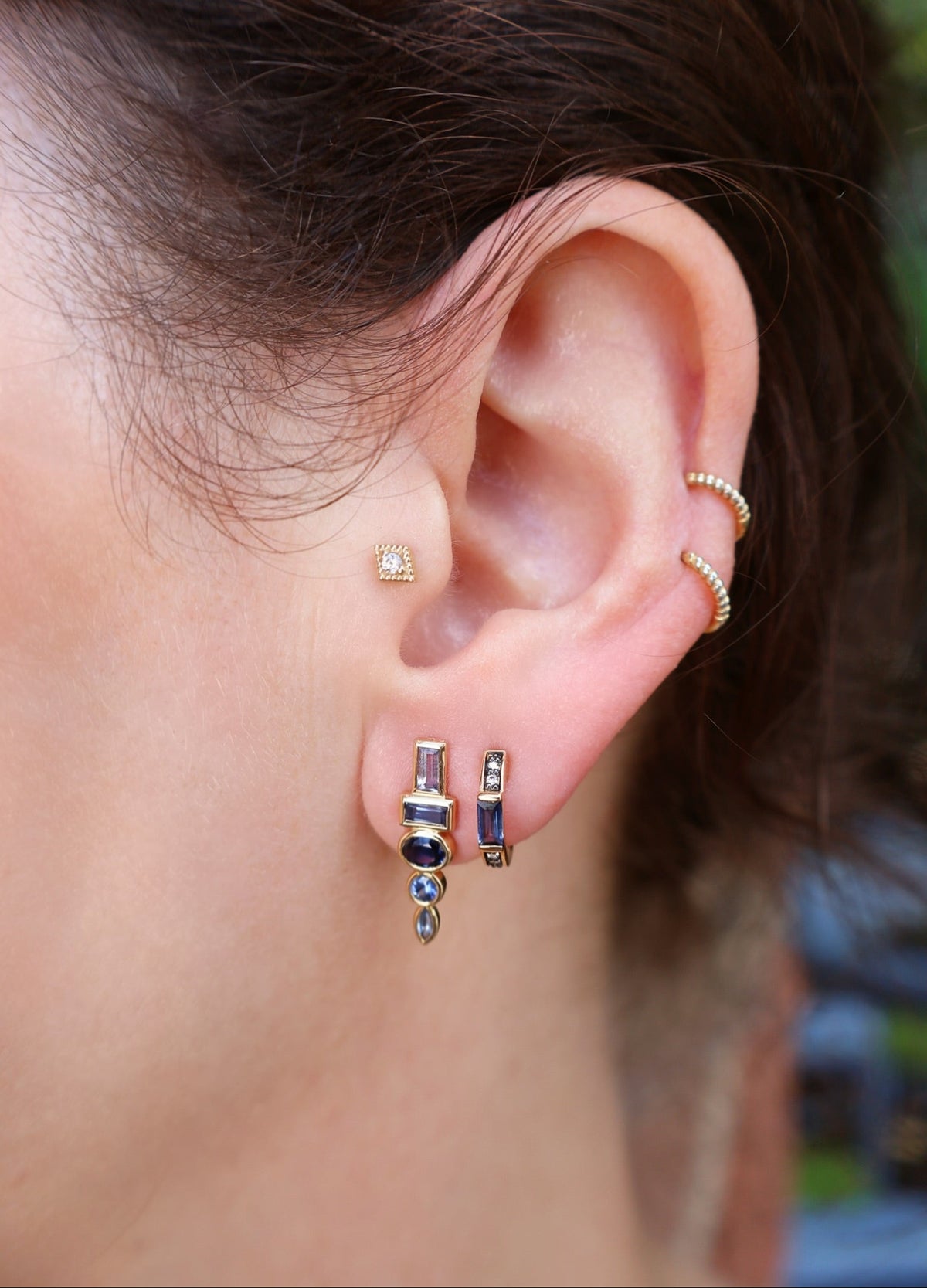 18k yellow gold diamond and blue sapphire Otto huggies with black rhodium detail by Sorellina Tiny Gods 